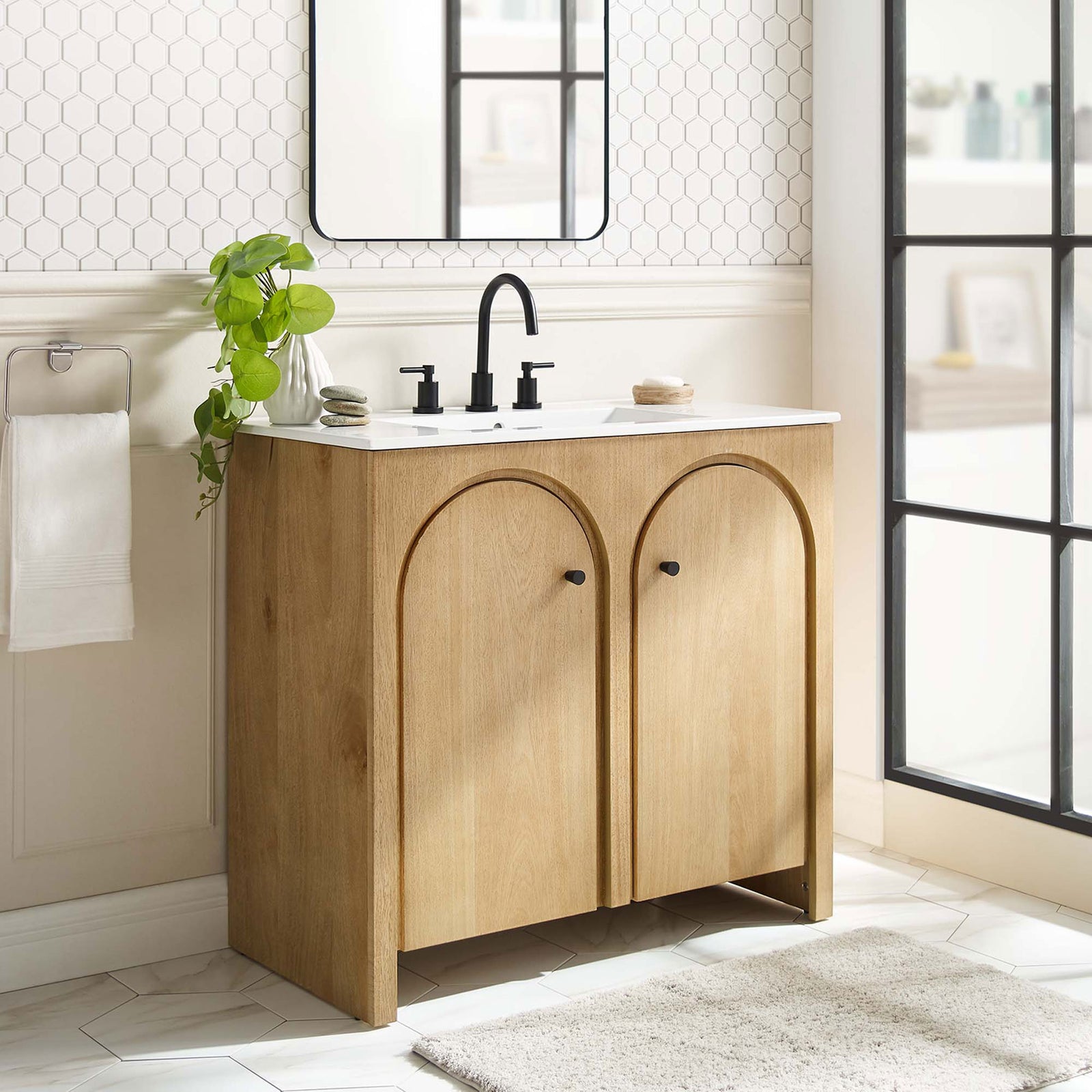 Organic oak tone and arched doors elevate everyday routines with a calm, contemporary presence. || EEI-6790-OAK-WHI || front_angle_room