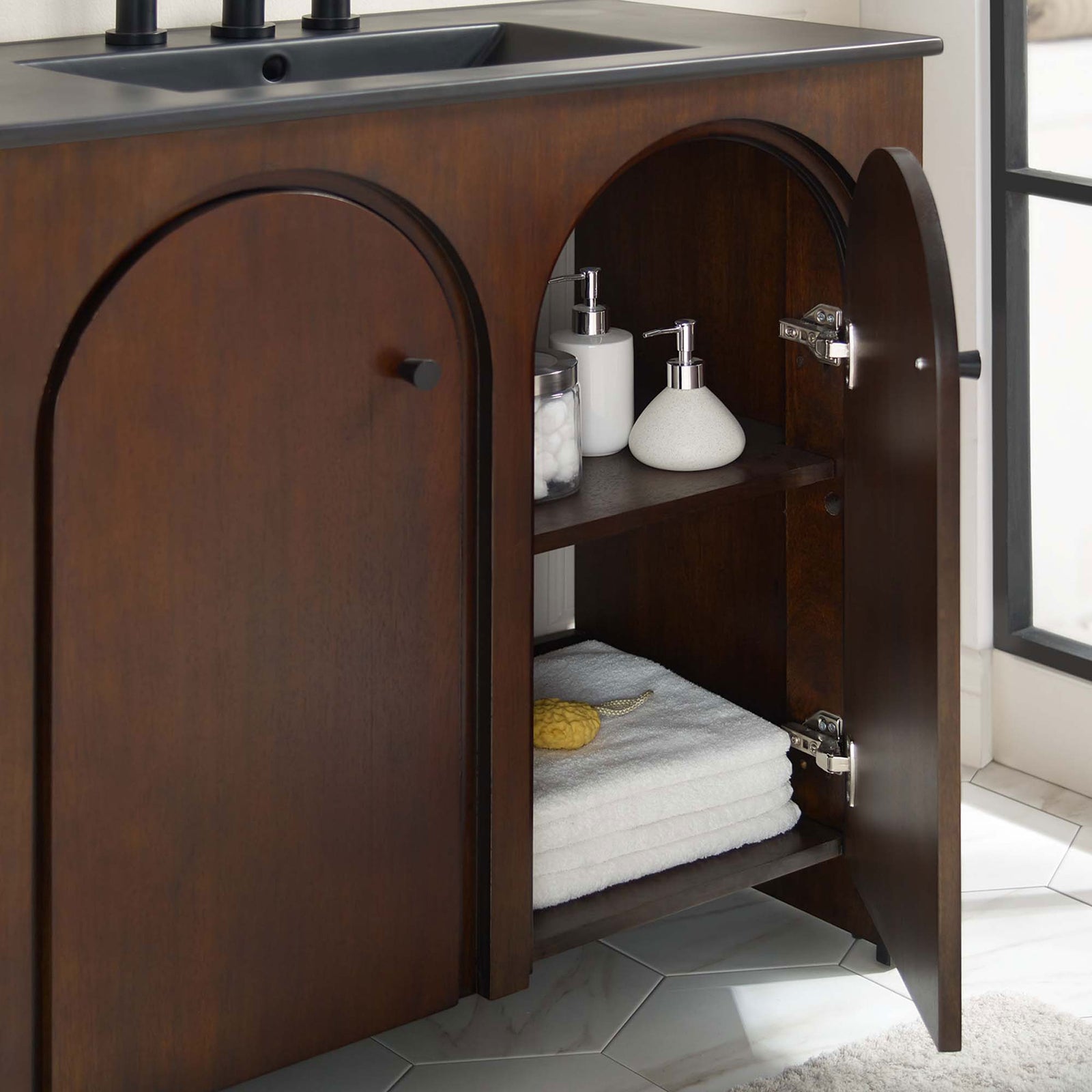 Spacious interior shelving keeps towels and essentials neatly organized behind soft close doors || EEI-6791-WAL-BLK || storage_open_room