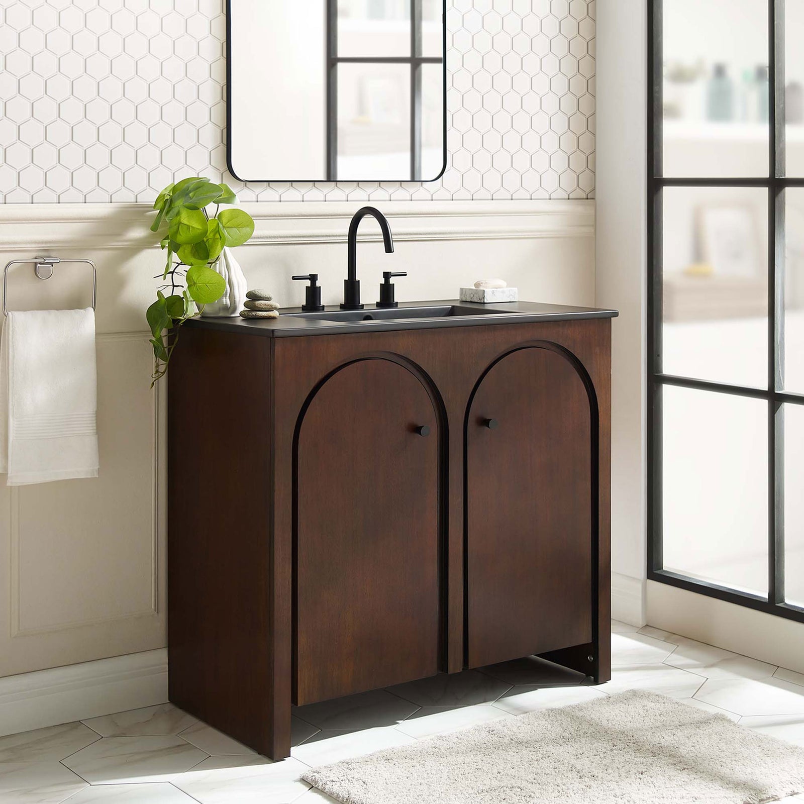 Warm walnut finish and graceful arches elevate the bathroom with a modern, organic look || EEI-6791-WAL-BLK || front_room