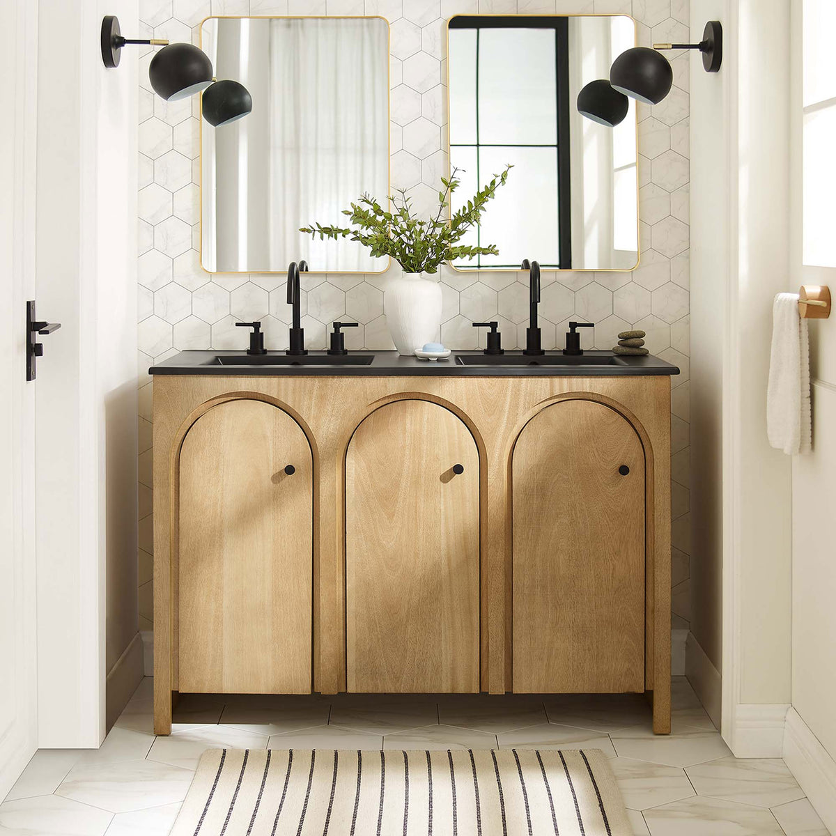 Warm oak finish and graceful arches anchor a modern double-sink centerpiece in the bath || EEI-6793-OAK-BLK || front_room