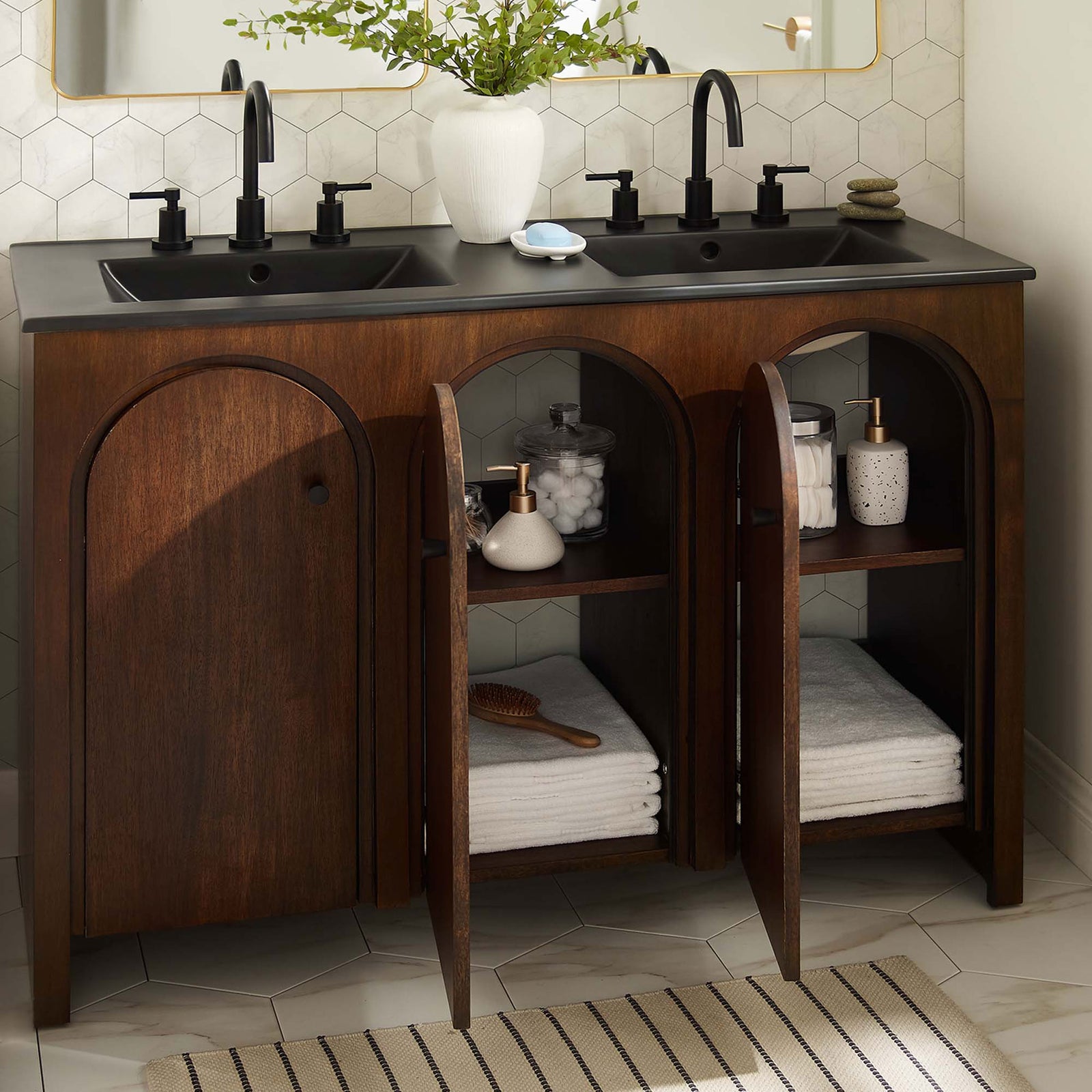 Arched doors open to reveal organized storage while black double sinks elevate this bright bathroom || EEI-6793-WAL-BLK || front_open_room