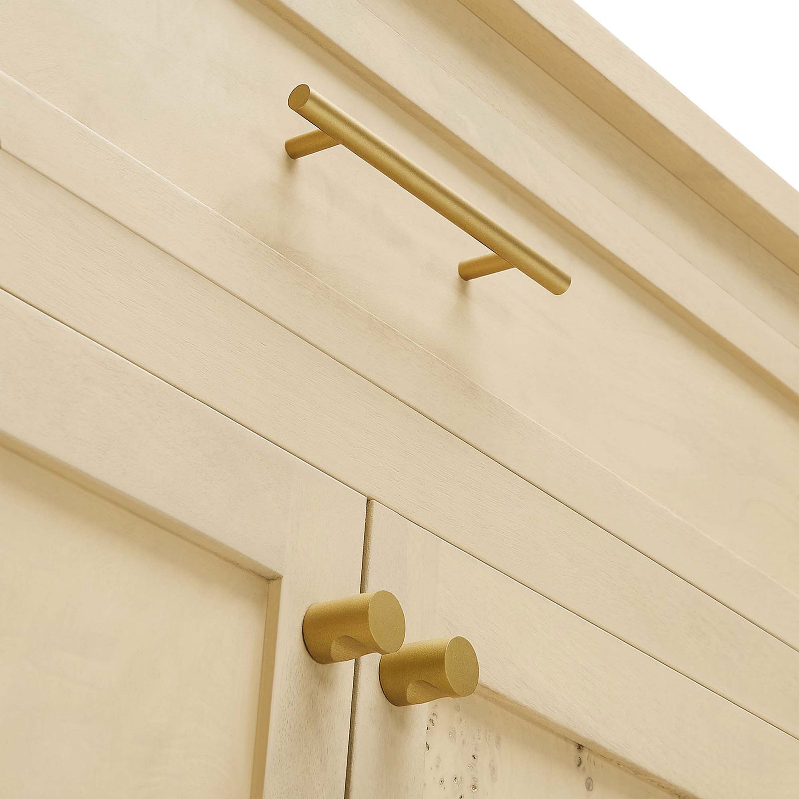 Brushed gold-tone bar pulls and round knobs add modern contrast against the light burl wood cabinet fronts || EEI-6794-BUR || handle_studio