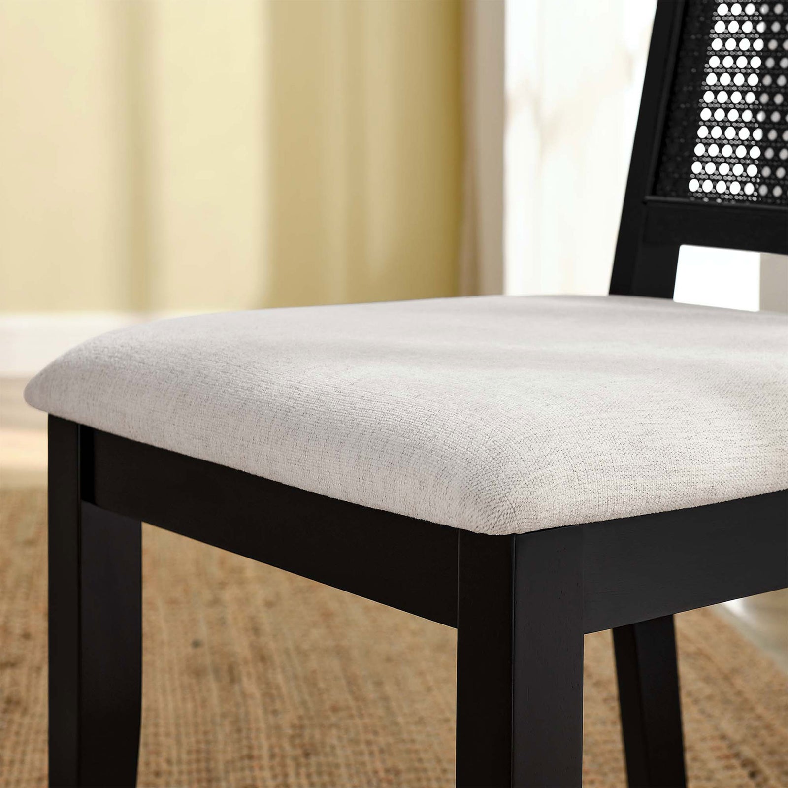 Ivory heathered weave seat cushion on black wood frame styled in a warm dining room || EEI-6803-BLK-BLK-HEI || detail_room