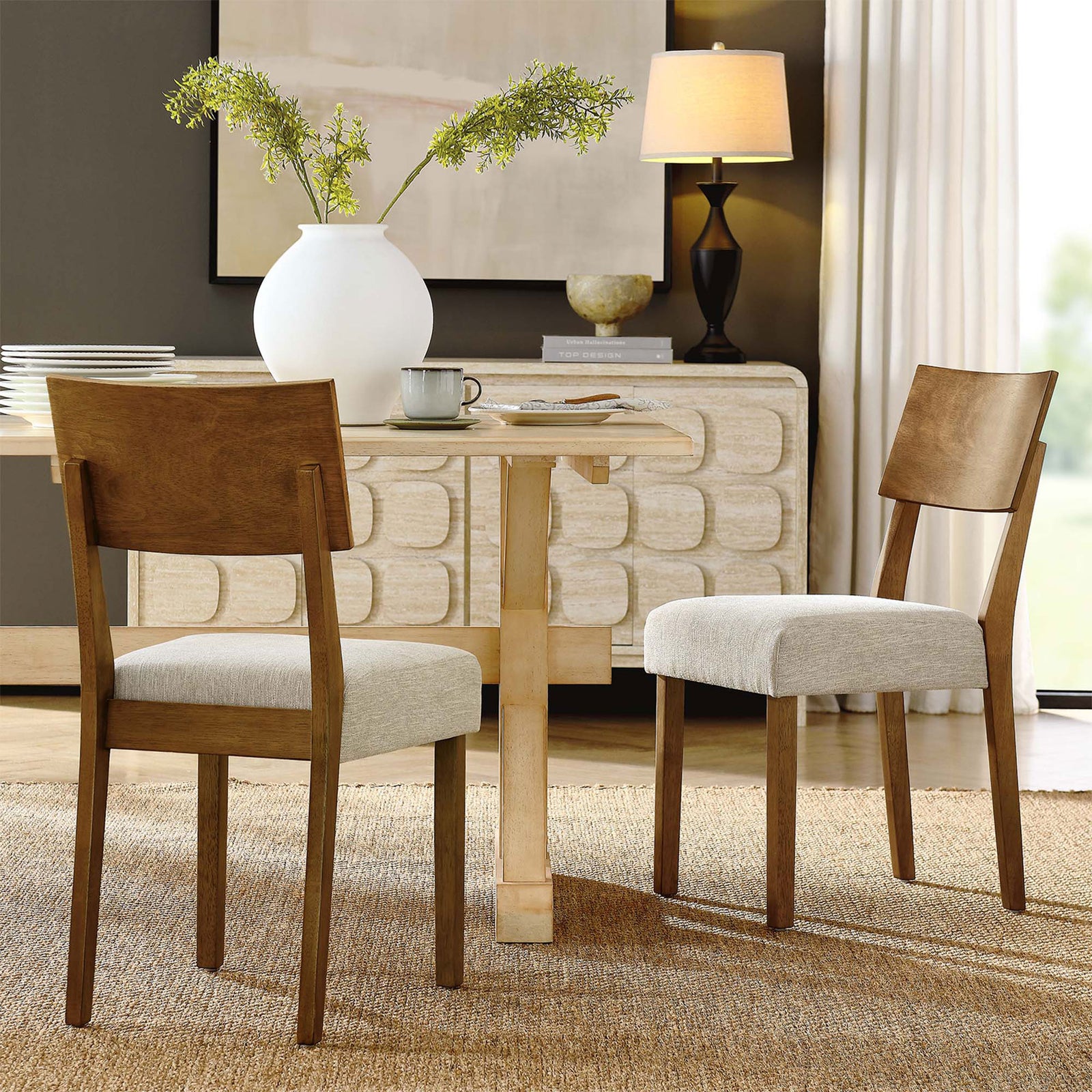 Pax wood dining side chairs in acorn finish styled around a modern table for a warm, inviting dining room || EEI-6804-ACO-HLB || front_angle_multi_room