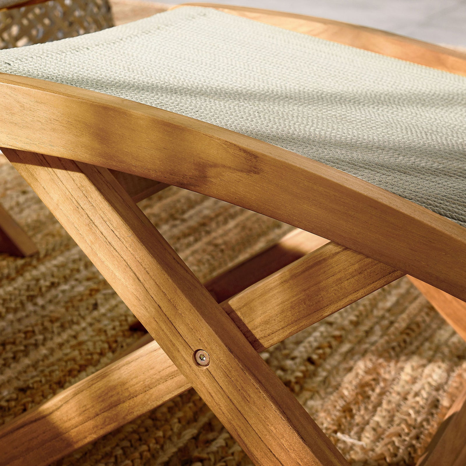 Curved teak frame and pale rope weave lend soft texture to this outdoor folding ottoman || EEI-6809-NAT-NAT || swatch_room