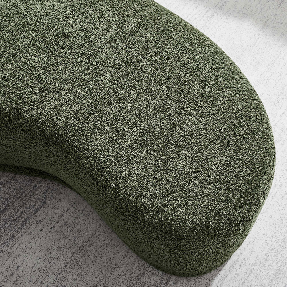 Textured sage green chenille surface of the Nimbus ottoman styled on a light, neutral area rug. || EEI-6816-SGE || detail_room