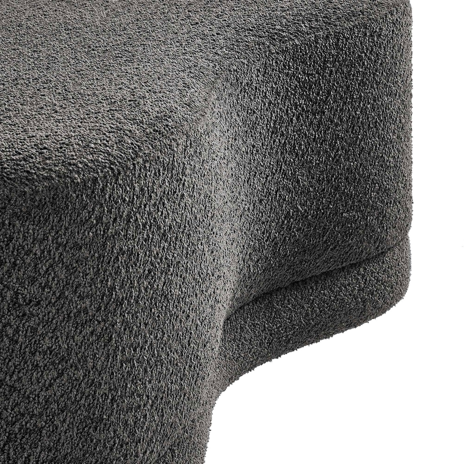 Textured dark gray chenille upholstery and curved edge detail of the Nimbus ottoman bench. || EEI-6816-SLA || detail_studio