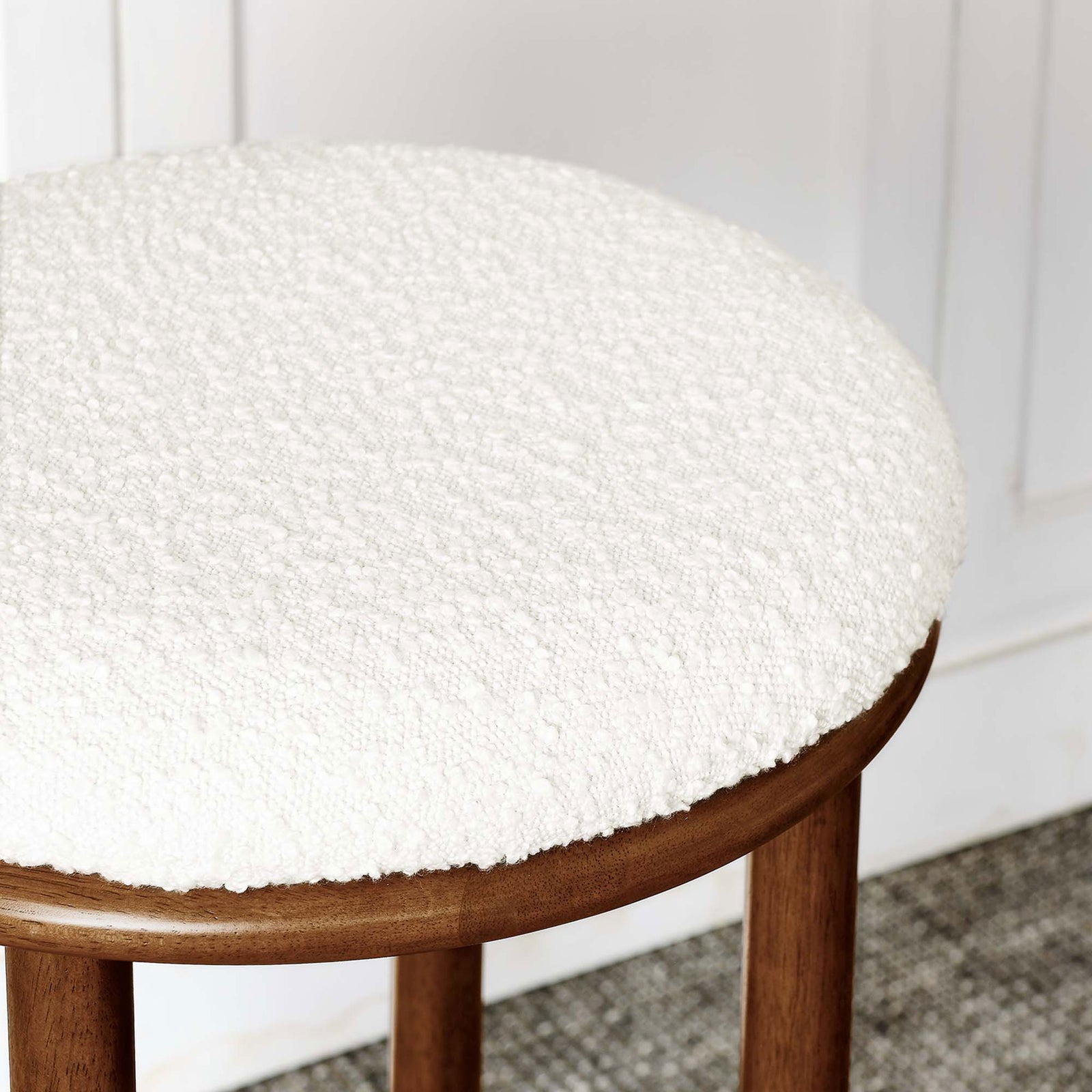 Ivory boucle upholstery offers a soft, nubby texture || EEI-6819-WAL-IVO || detail_room