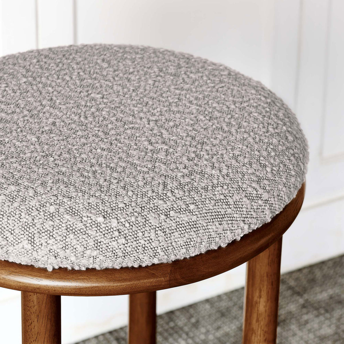 Nubby taupe boucle upholstery brings inviting texture to the clean, minimalist silhouette || EEI-6819-WAL-TAU || detail_room