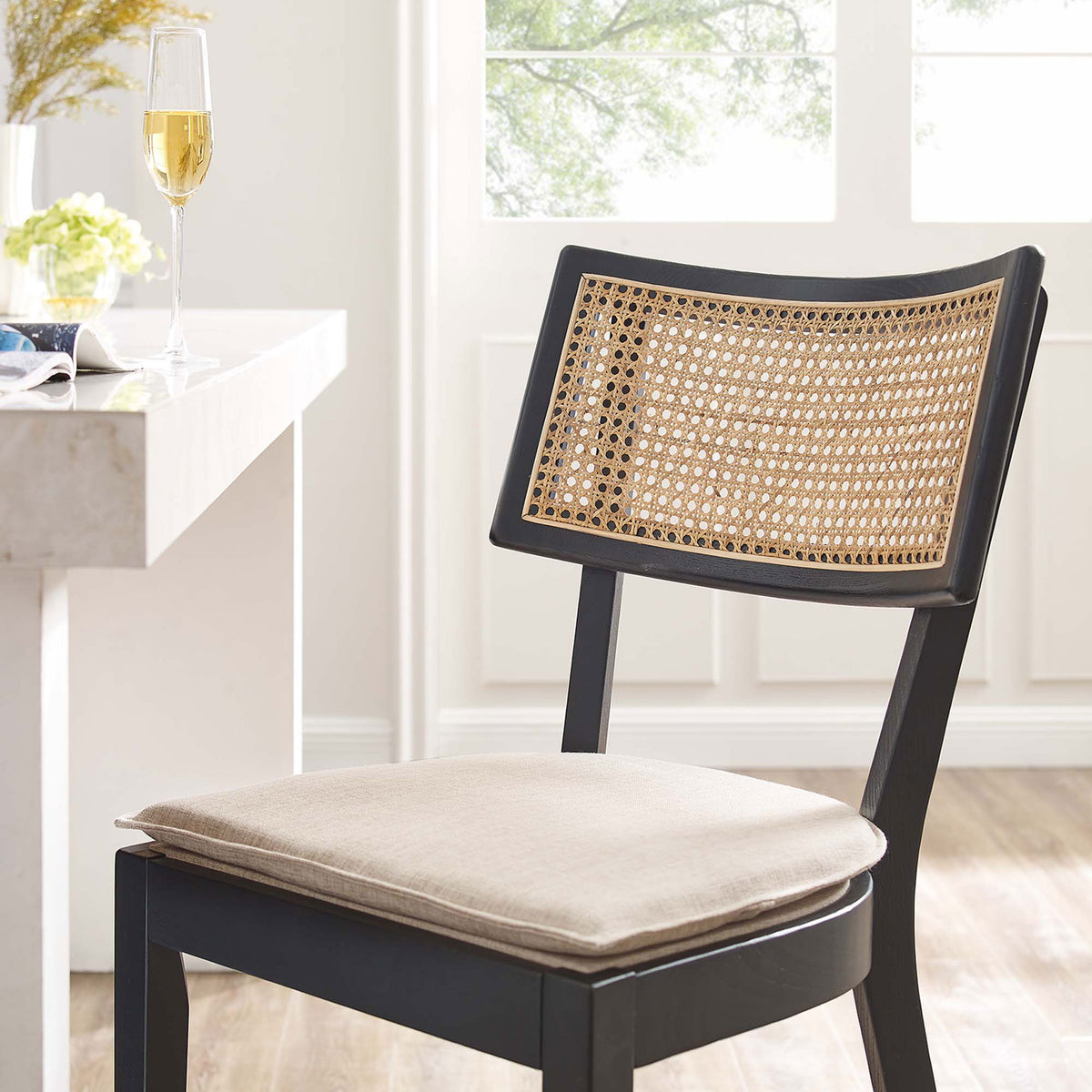 Inviting beige cushion and airy cane back create relaxed counter-side comfort || EEI-6821-BLK-BEI || detail_room