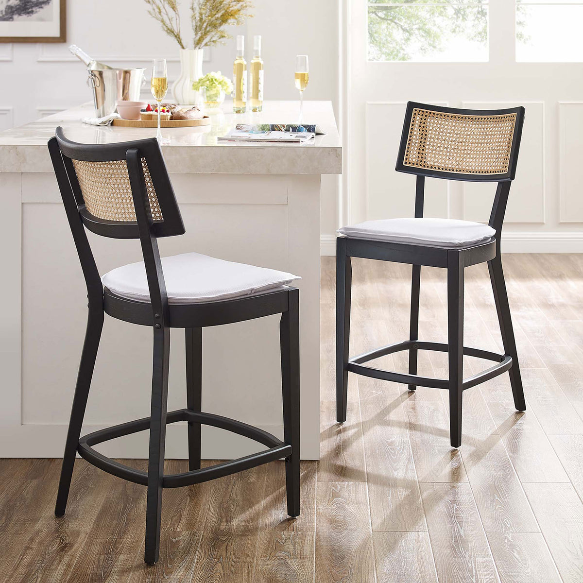 Elevate your island with two chic counter stools in black wood and natural rattan || EEI-6821-BLK-WHI || front_angle_multi_room