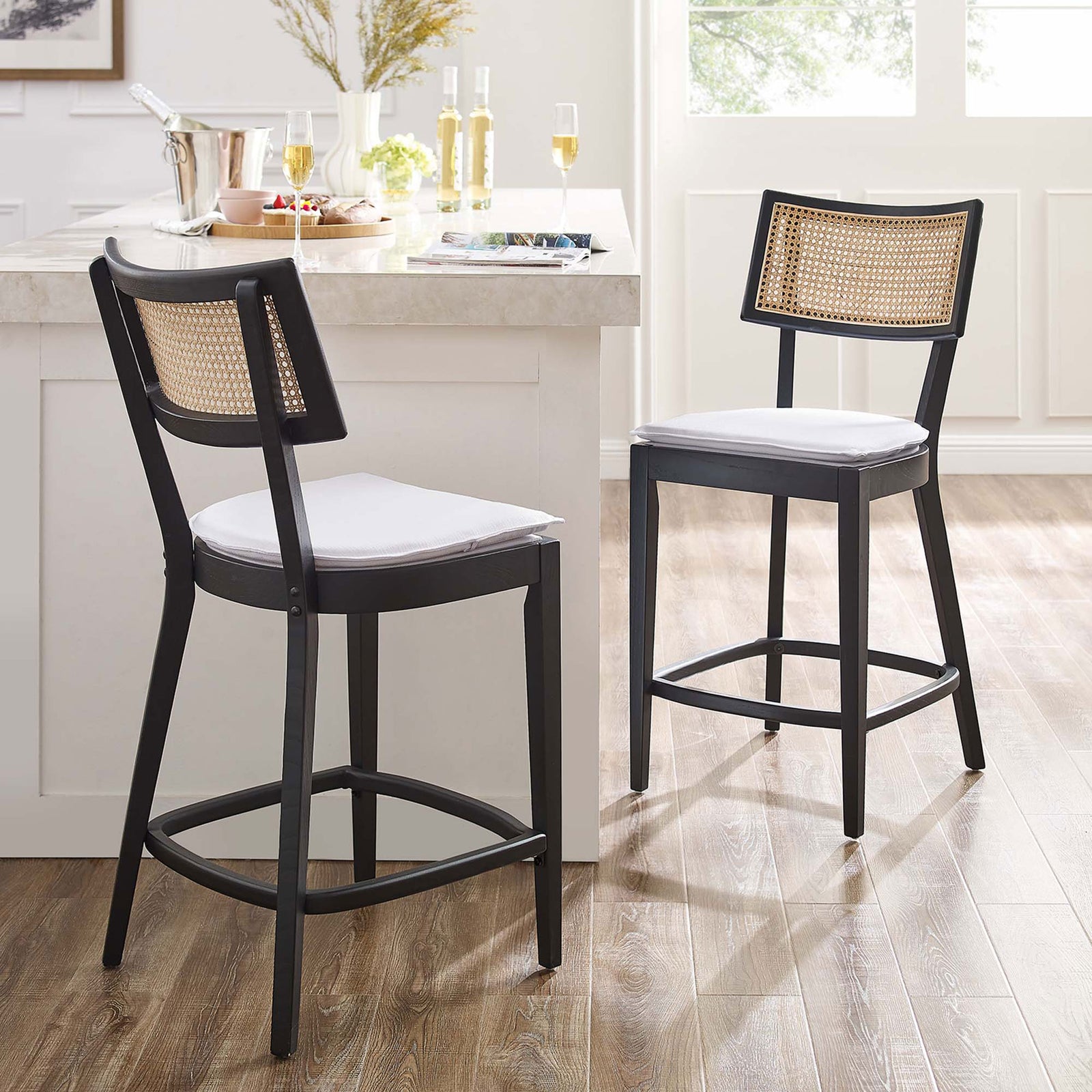 Elevate your island with two chic counter stools in black wood and natural rattan || EEI-6821-BLK-WHI || front_angle_multi_room