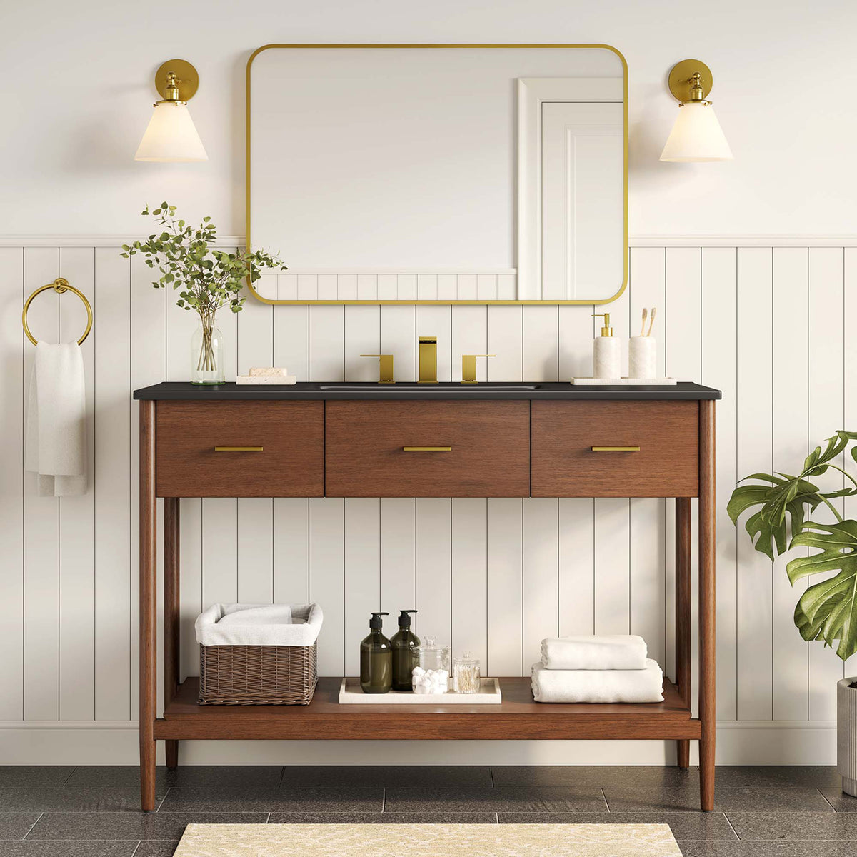 Refined walnut vanity pairs black countertop with brass accents for a modern bathroom || EEI-6825-WAL-BLK || front_room