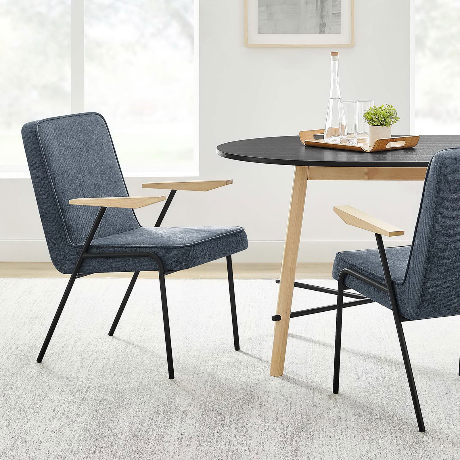 Laguna dining armchairs styled around a modern wood table in a bright, airy dining room || EEI-6835-LAG || front_angle_room