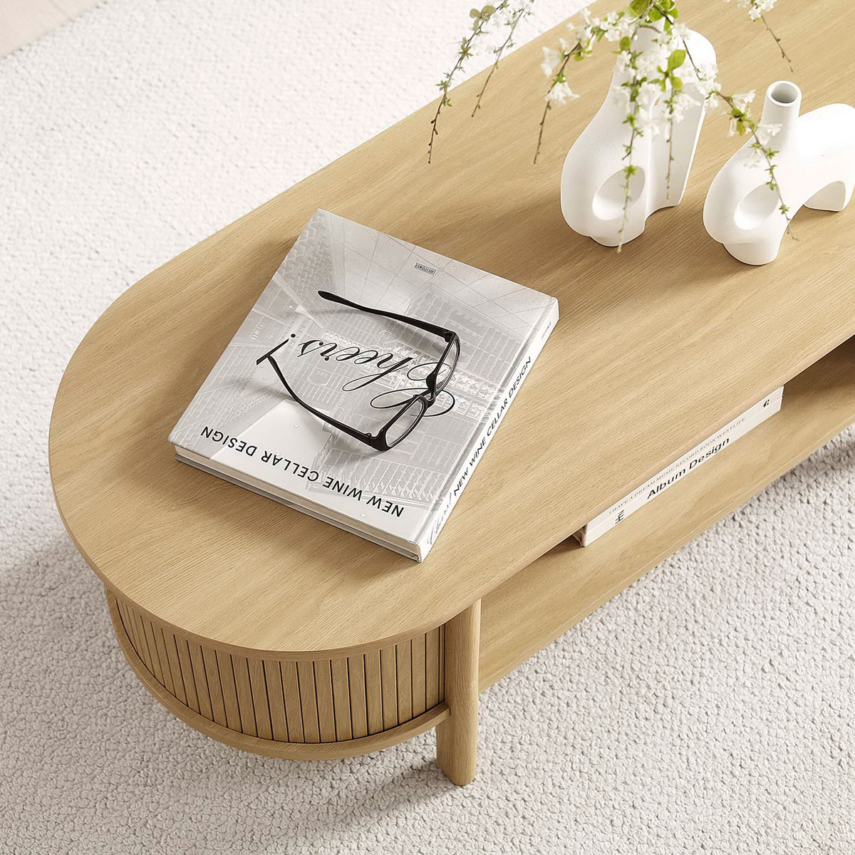 Warm oak surface styled for books and decor in a light, airy setting || EEI-6837-OAK || detail_room