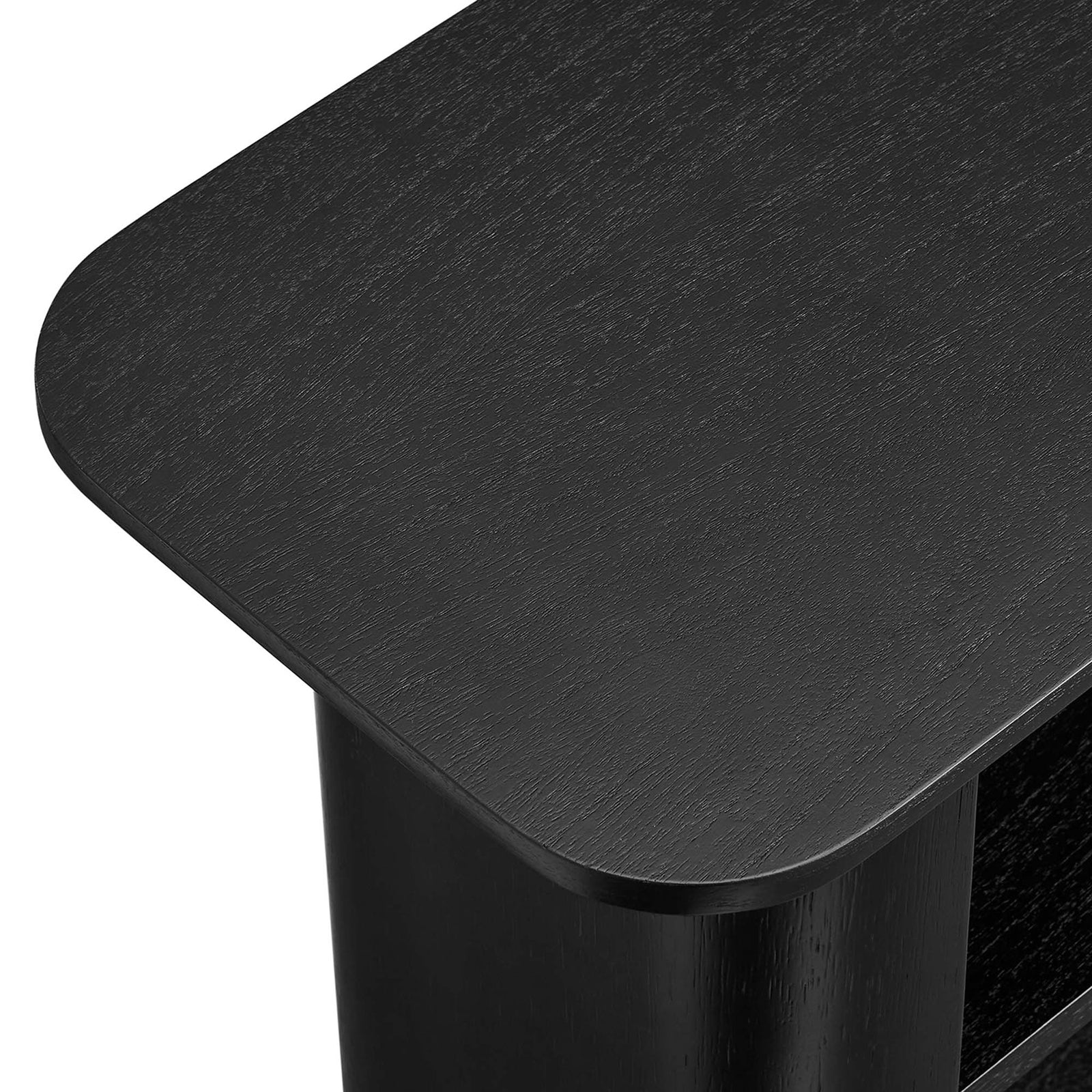 Smooth rounded tabletop corner with subtle wood grain texture in a deep black finish || EEI-6849-BLK || detail_studio