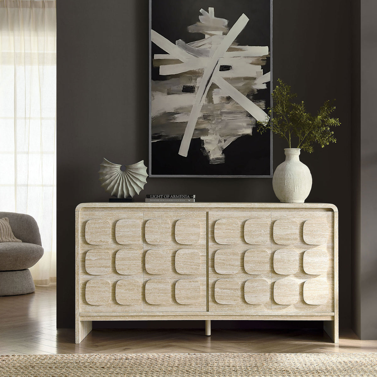 Toscana travertine-look sideboard styled with modern artwork, vases, and greenery in a cozy room || EEI-6862-TRA || front_room