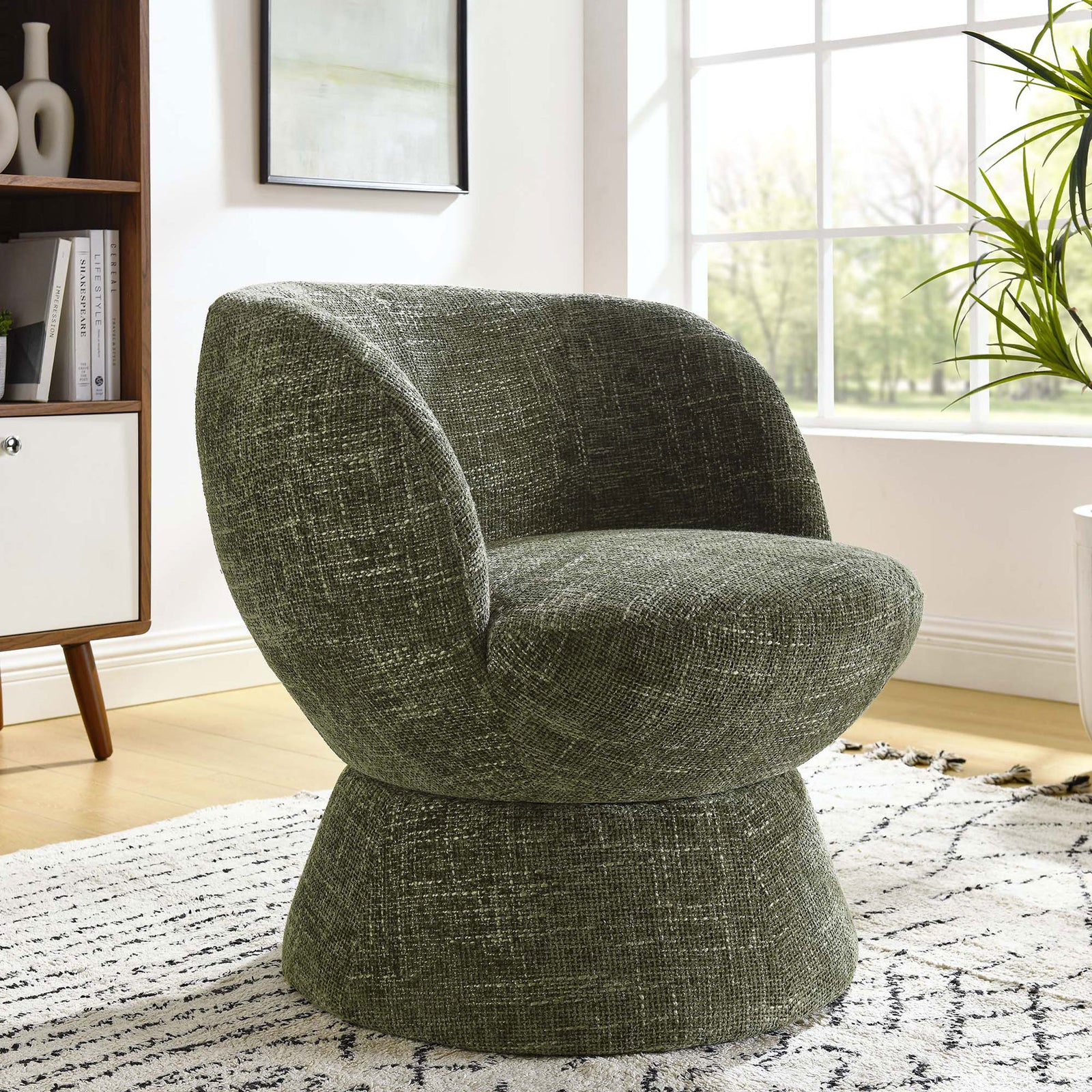 Modern accent adds warmth to living spaces with basil chenille and a rounded swivel base || EEI-6863-BAS || front_angle_room