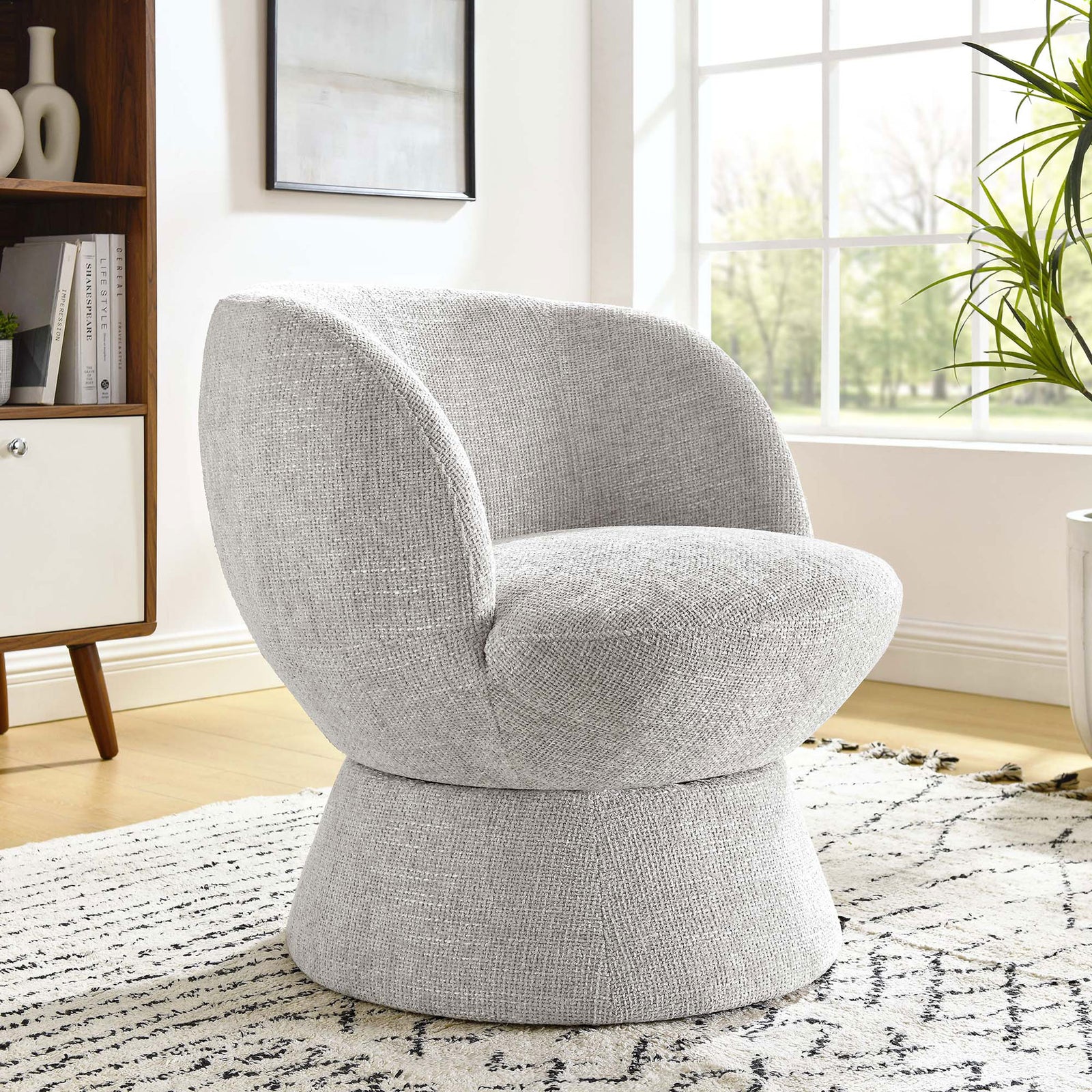Chic dove gray swivel chair adds cozy texture and modern curves to living spaces. || EEI-6863-DOV || front_angle_room