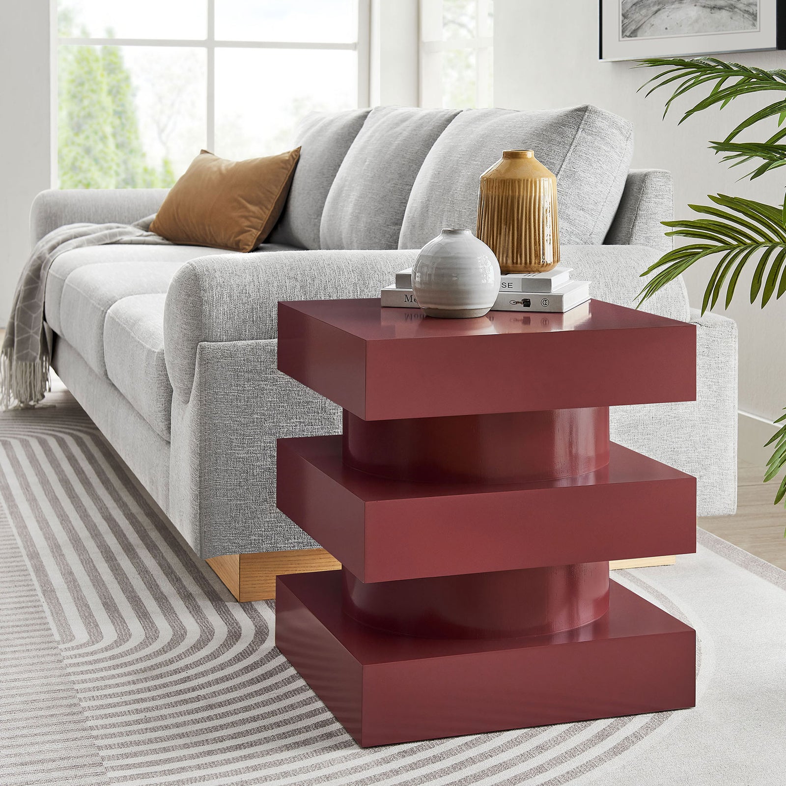 Contemporary totem end table anchoring a light living room, adding bold color and sculptural form || EEI-6864-SPA || front_angle_room