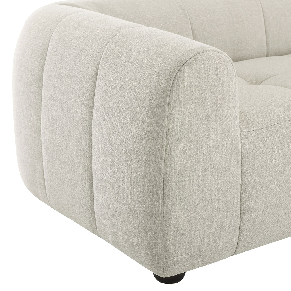 Sofas linen upholstery and plush channel tufting create a soft, inviting texture along the arm and seat || EEI-6866-LIN || detail_studio