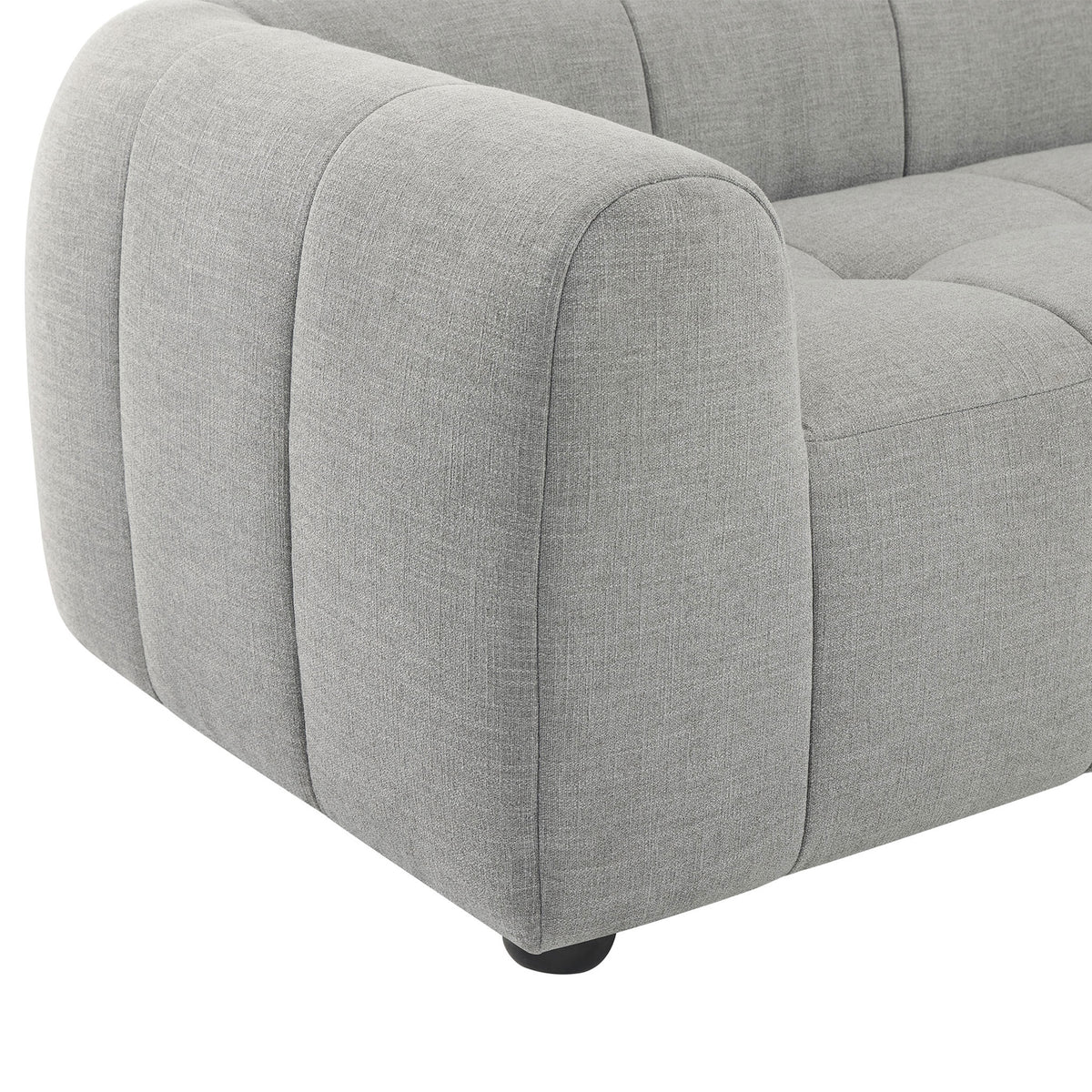 Plush grid-tufted seat and thick armrest in soft pewter fabric anchored by a rounded wood bun foot || EEI-6866-PEW || detail_studio