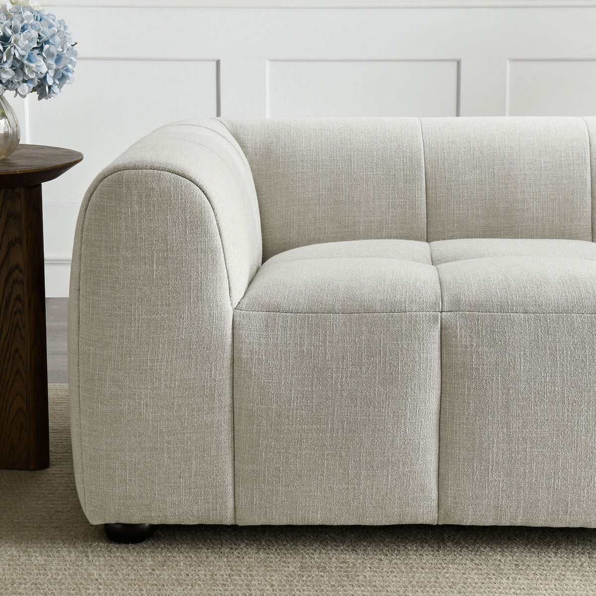 Textured linen fabric and tailored stitching on the loveseat arm for a soft, inviting feel || EEI-6867-LIN || detail_room