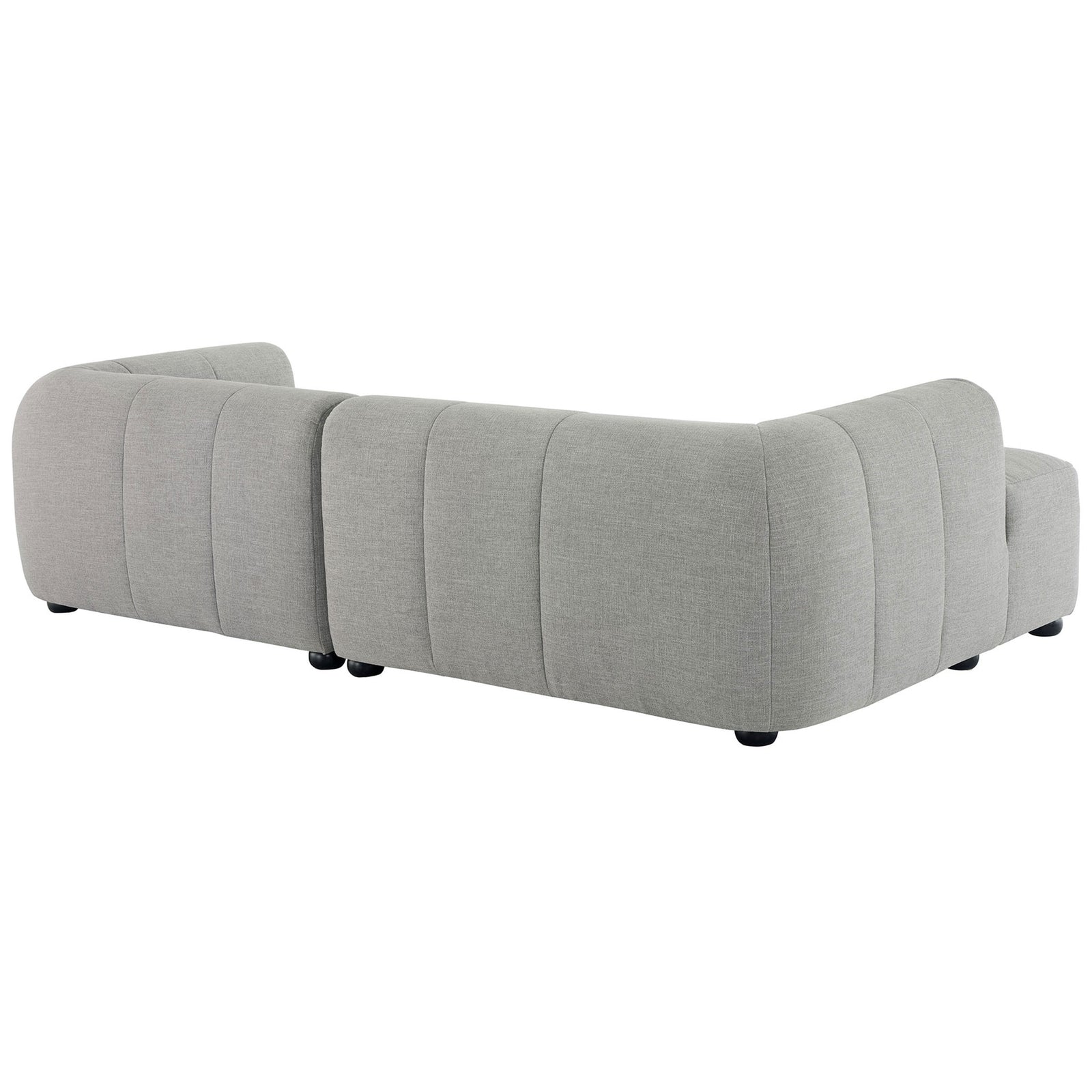 Back view of the Liana left-facing chaise sectional with clean tailoring and bun feet. || EEI-6868-PEW || back_angle_studio