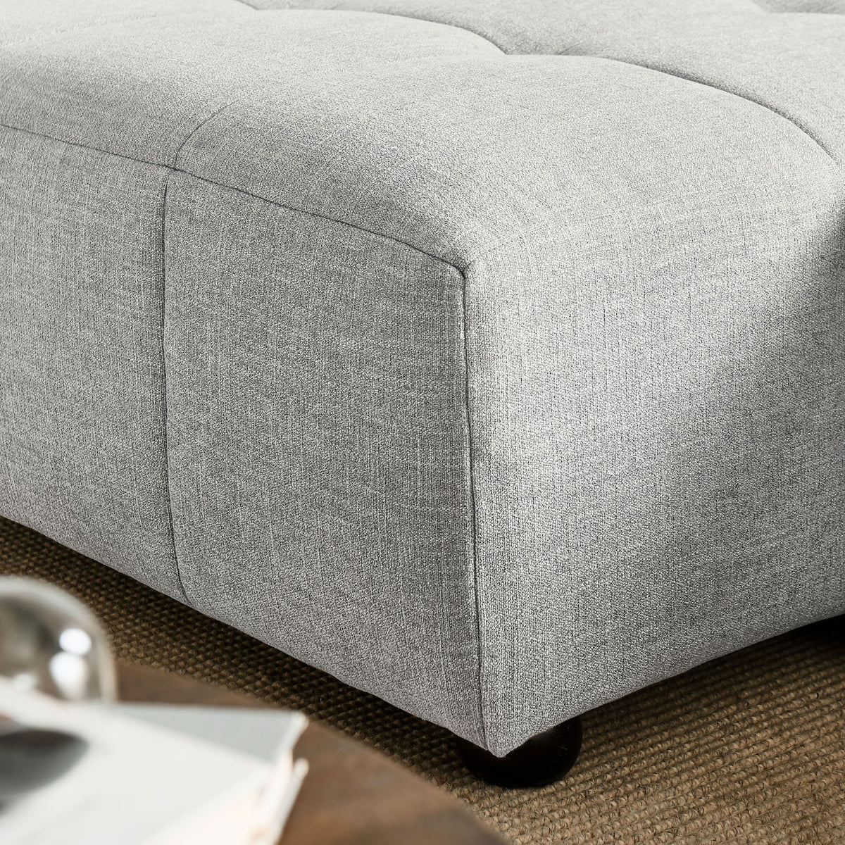 Close-up of the chaise corner highlighting the soft pewter fabric texture and stitched seams. || EEI-6868-PEW || swatch_room