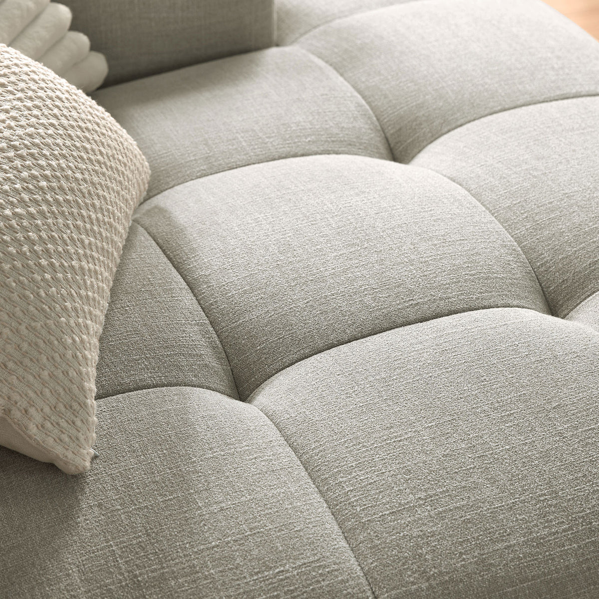 Linen upholstery and plush grid-tufted cushion detail on the right-facing Liana chaise sofa || EEI-6869-LIN || swatch_room