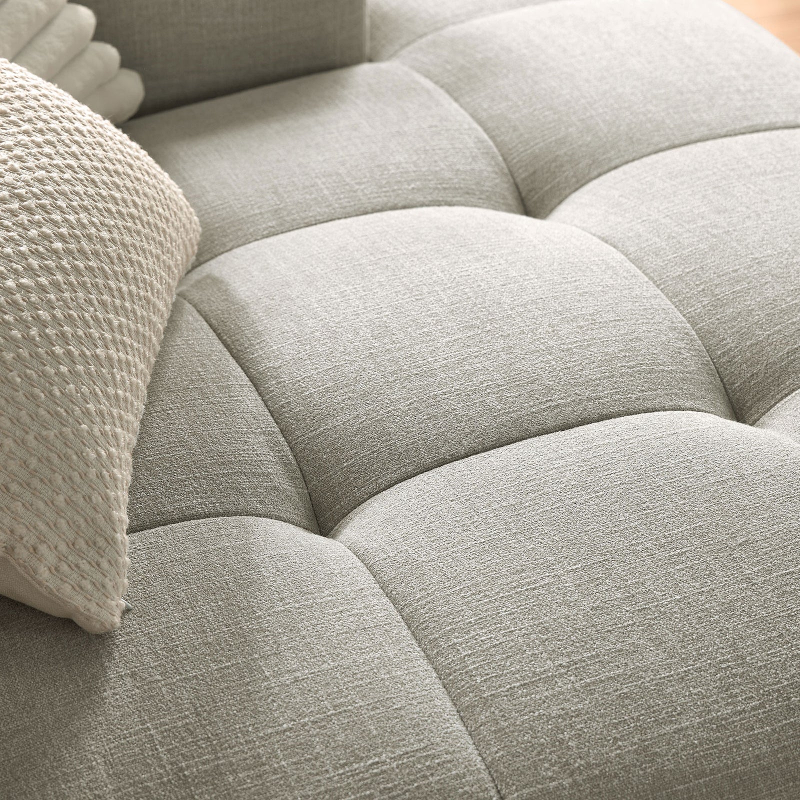 Linen upholstery and plush grid-tufted cushion detail on the right-facing Liana chaise sofa || EEI-6869-LIN || swatch_room