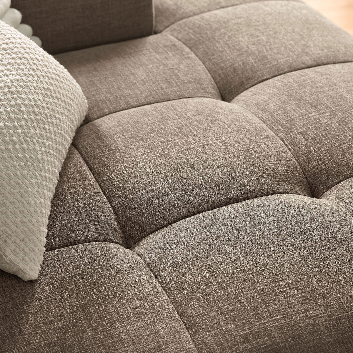 Tufted mocha upholstery on the Liana right-facing chaise shows plush cushioning and soft woven texture || EEI-6869-MOC || detail_room