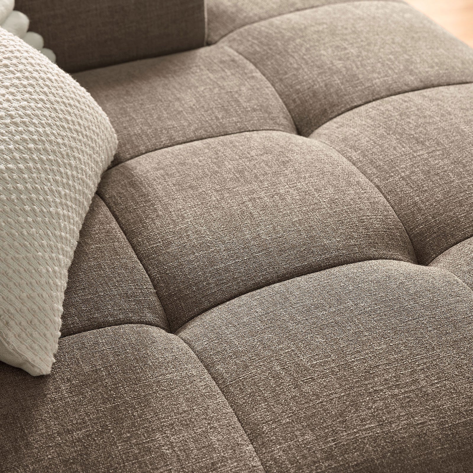 Tufted mocha upholstery on the Liana right-facing chaise shows plush cushioning and soft woven texture || EEI-6869-MOC || detail_room