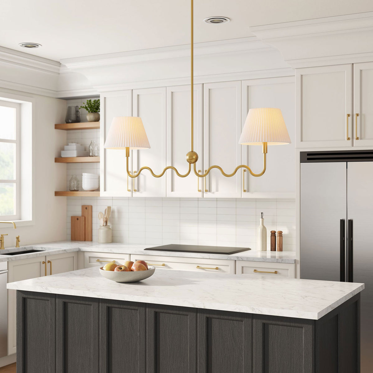 Pleated shades glow warmly above the island on a sculptural brass frame || EEI-6874-BRA || front_angle_on_room