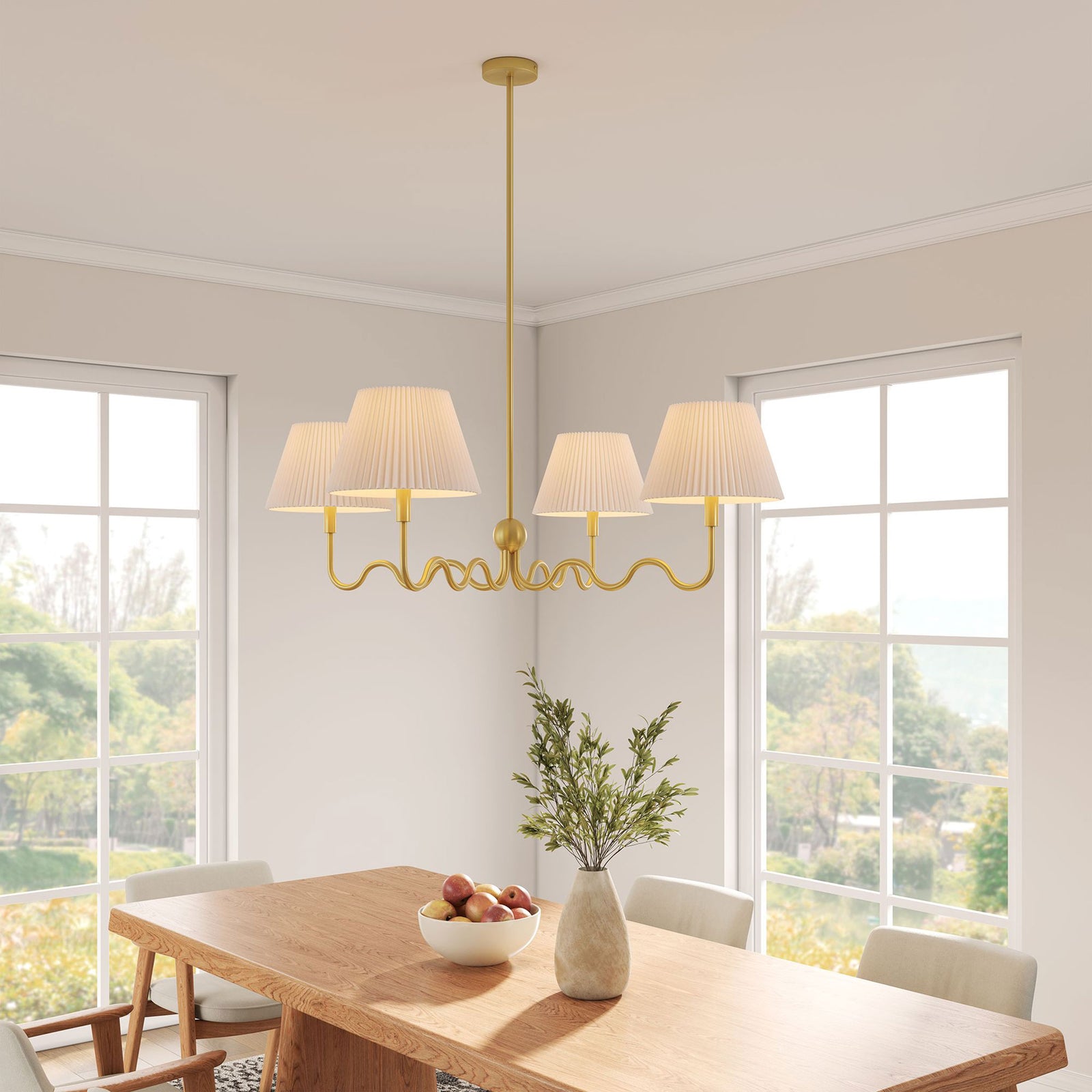 Brass squiggle chandelier casts a warm glow over the table with four pleated shades || EEI-6875-BRA || front_angle_on_room