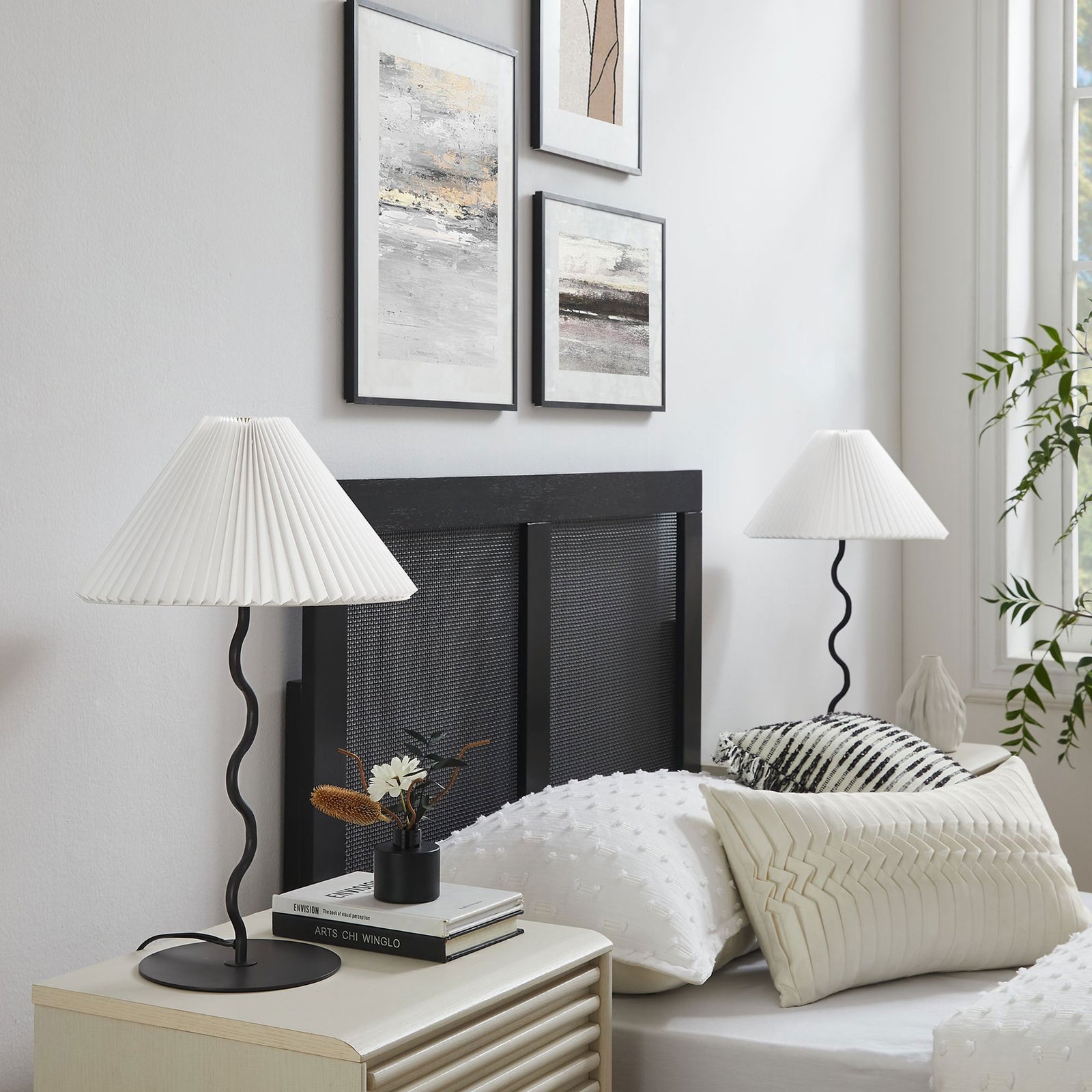 Pair of Wave squiggle table lamps framing a modern bed, adding sculptural interest to a serene bedroom || EEI-6876-BLK || front_angle_room