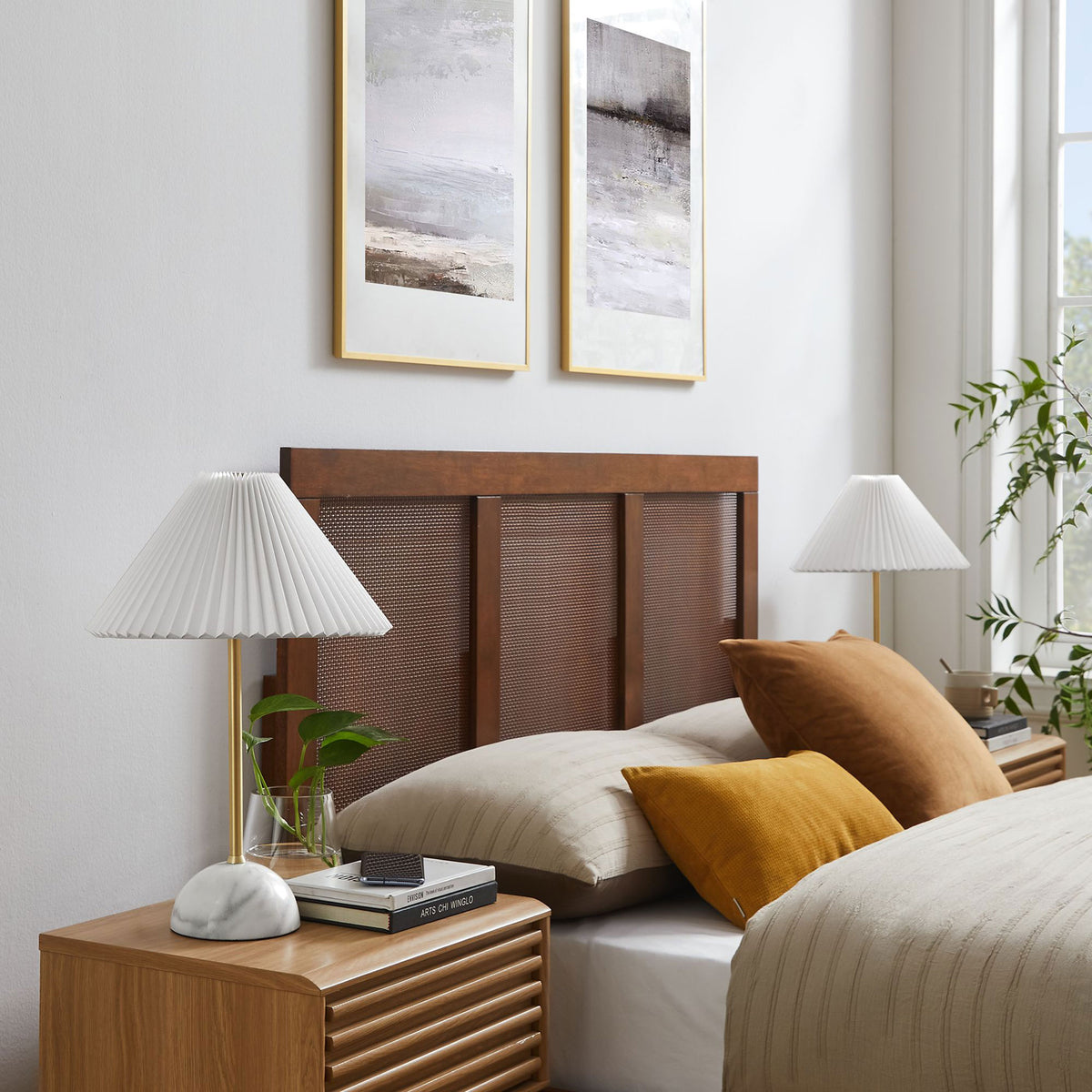 Pair of Illusion lamps framing a bed with marble bases, brass stems, and crisp pleated shades. || EEI-6878-BRA || front_angle_room