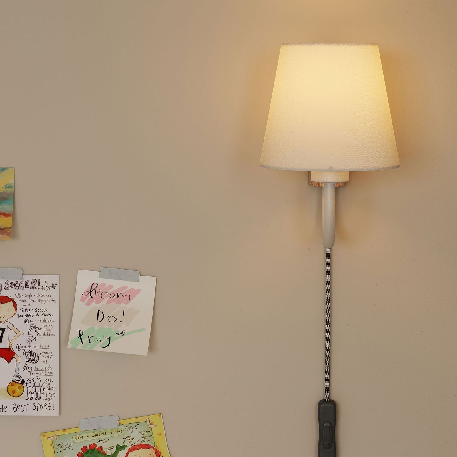 Glowing white U arm wall sconce brightens a wall of playful artwork and notes || EEI-6880-NAT-WHI || front_on_room