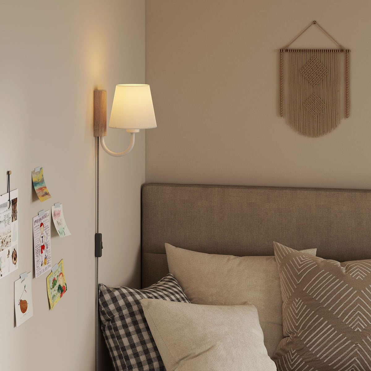 Natural wood and white U arm wall sconce creates a warm reading light beside a layered bed || EEI-6880-NAT-WHI || front_angle_on_room