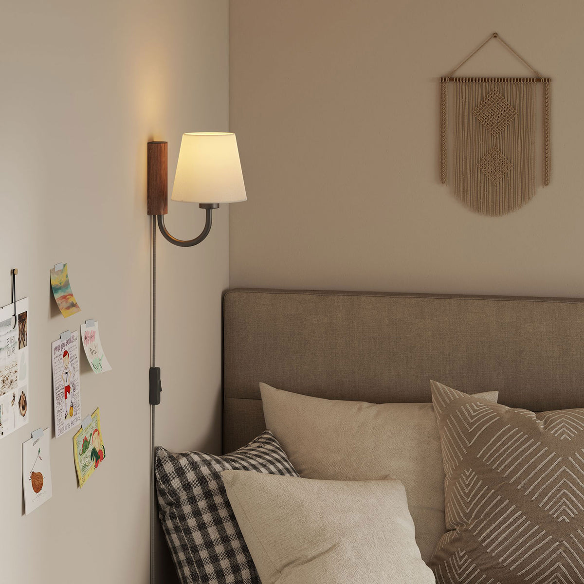 Walnut and black U arm wall sconce adds focused reading light beside a cozy upholstered bed || EEI-6880-WAL-BLK || front_angle_on_room