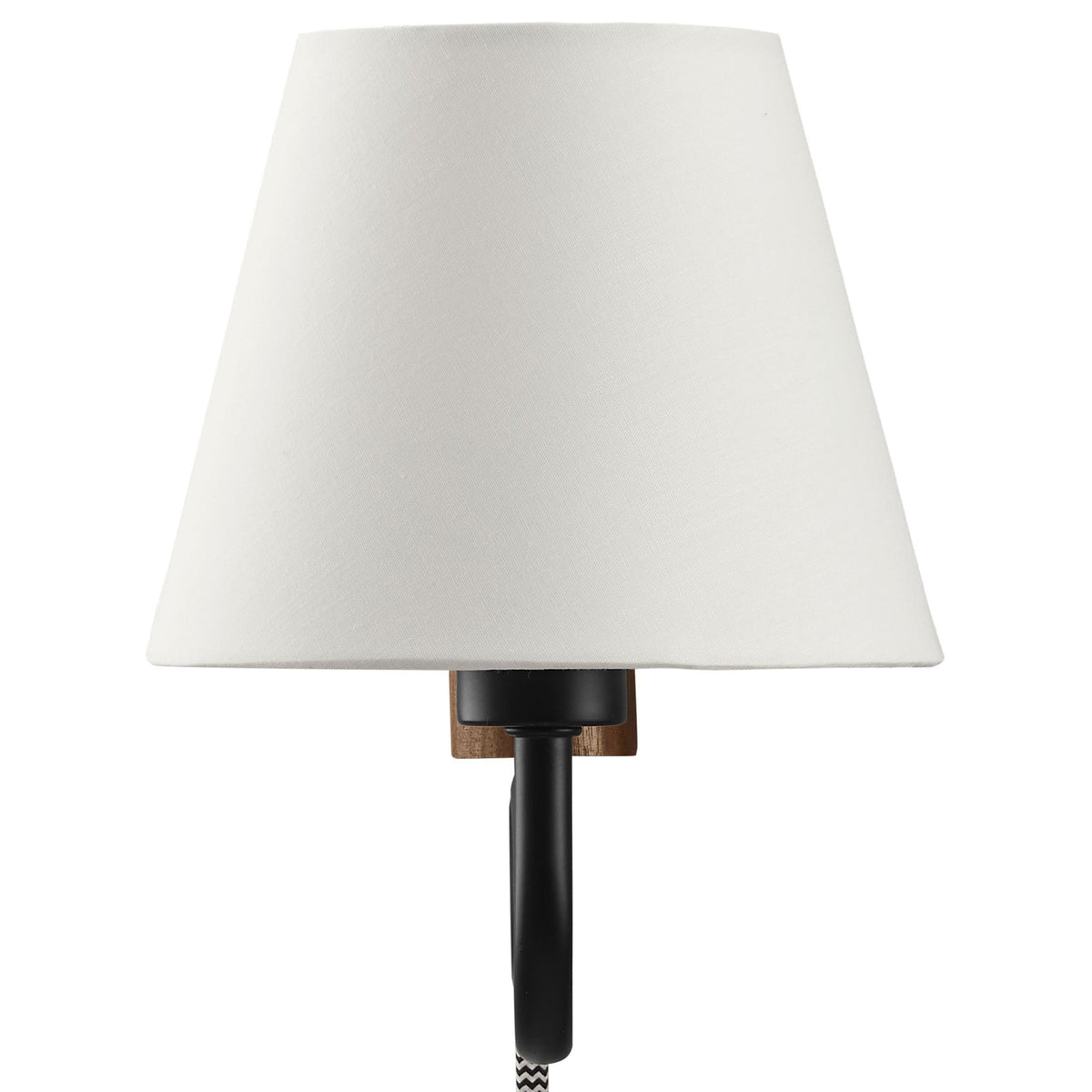 Tapered white fabric shade softens the glow on this playful squiggle arm wall sconce || EEI-6881-WAL-BLK || front_studio