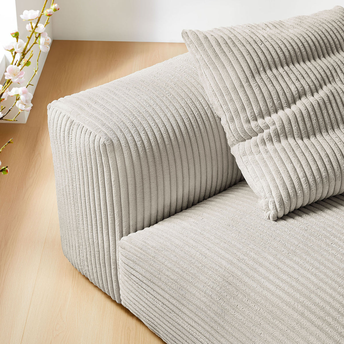 Soft corduroy texture and rounded back and seat edges bring inviting comfort to the room || EEI-6884-ALM || detail_room