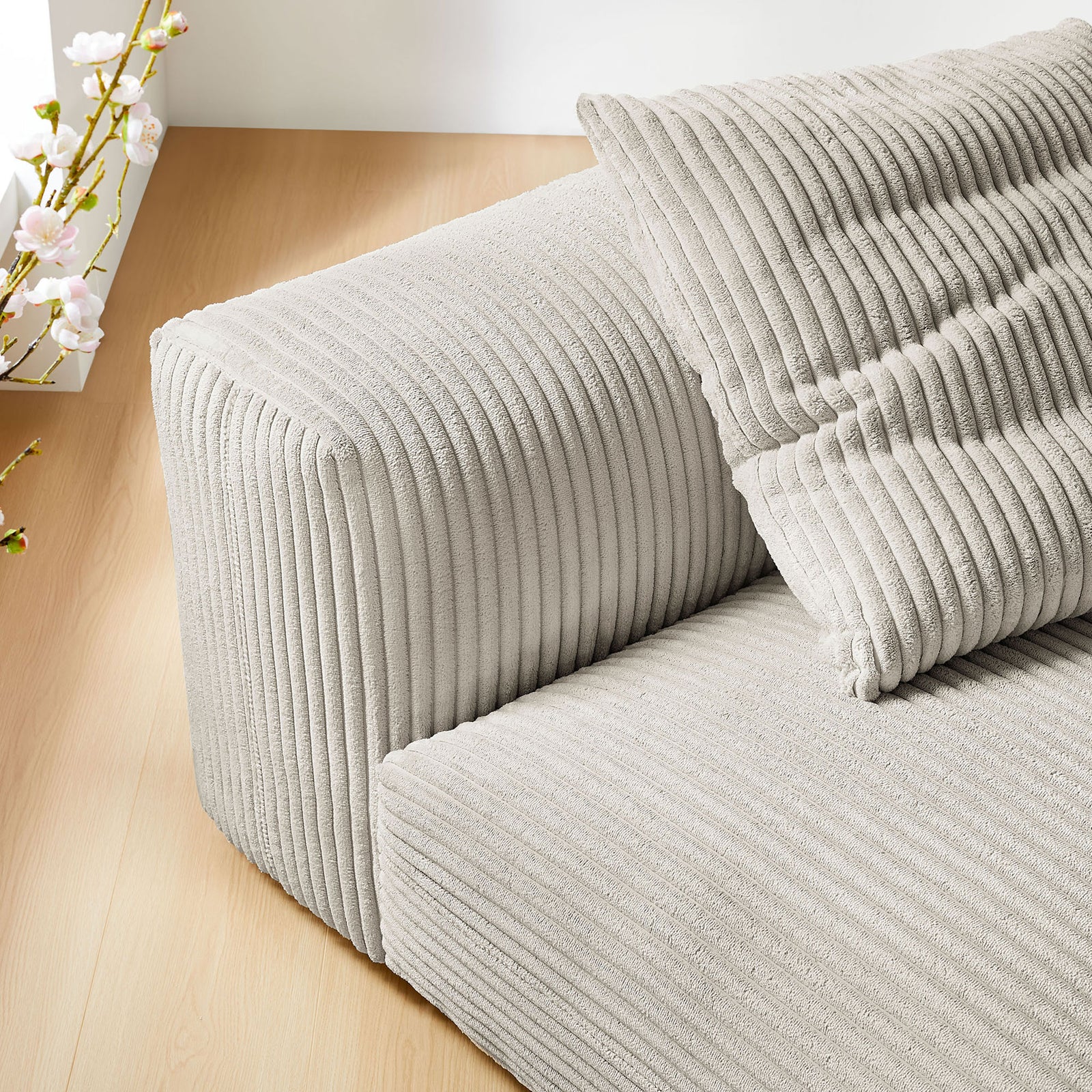 Soft corduroy texture and rounded back and seat edges bring inviting comfort to the room || EEI-6884-ALM || detail_room