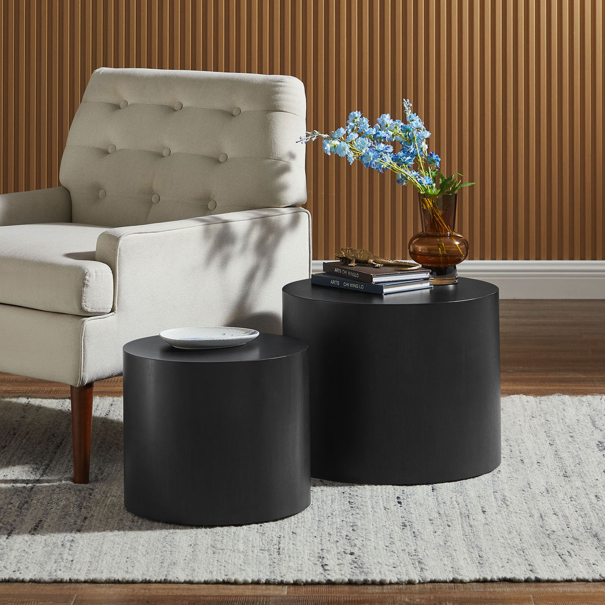 Two round drum tables in black ash wood veneer provide layered surfaces and space-saving flexibility || EEI-6893-BLK || front_angle_room