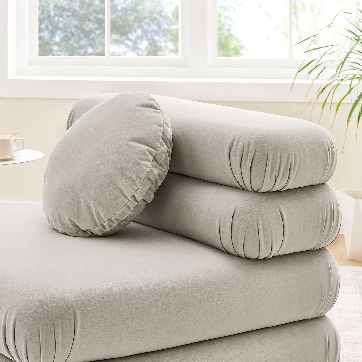 Velvety upholstery and stacked cushion layers offer tactile softness and support || EEI-6896-ALM || detail_room