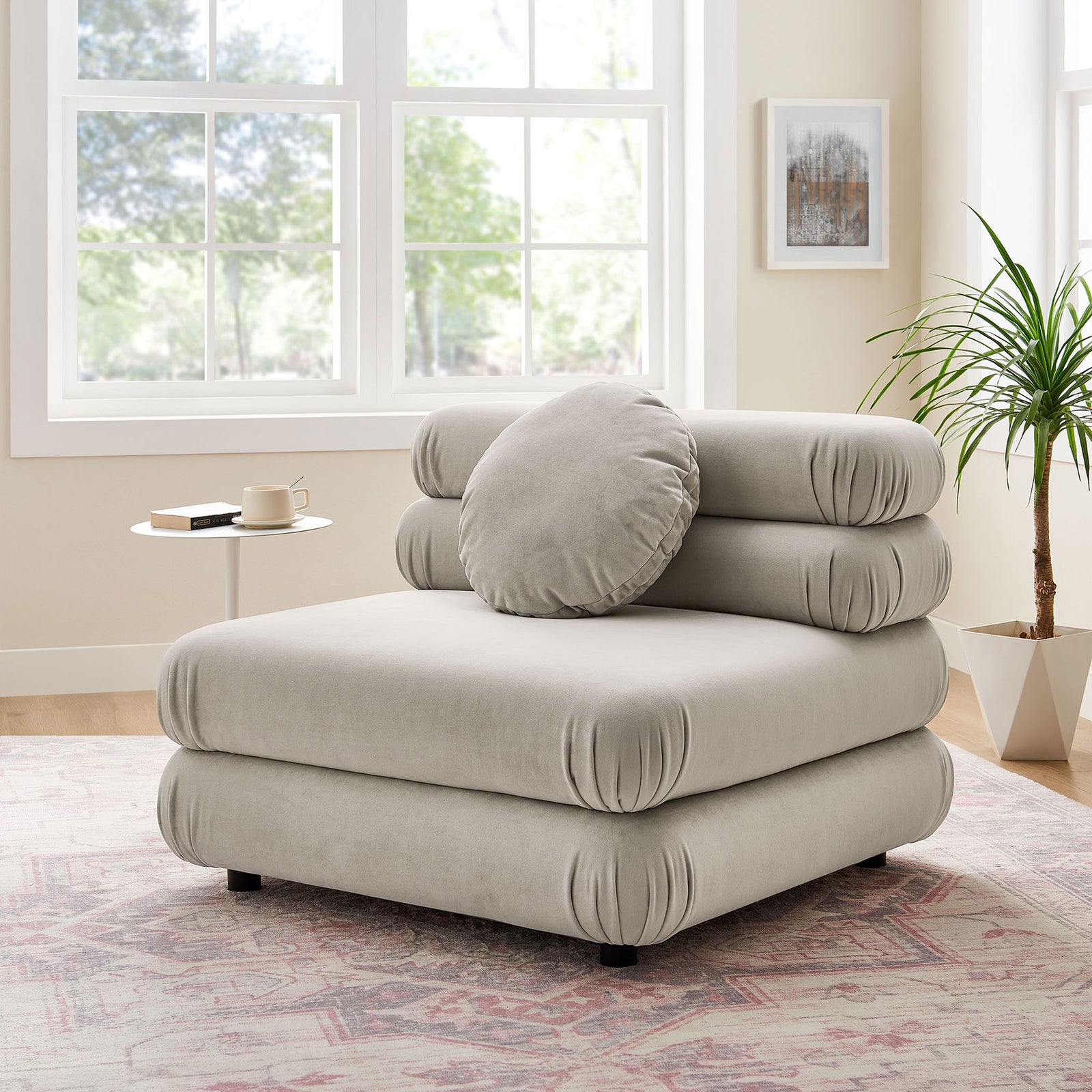 Elevate your lounge with this modular armless chair and round pillow in a serene almond hue || EEI-6896-ALM || front_angle_room