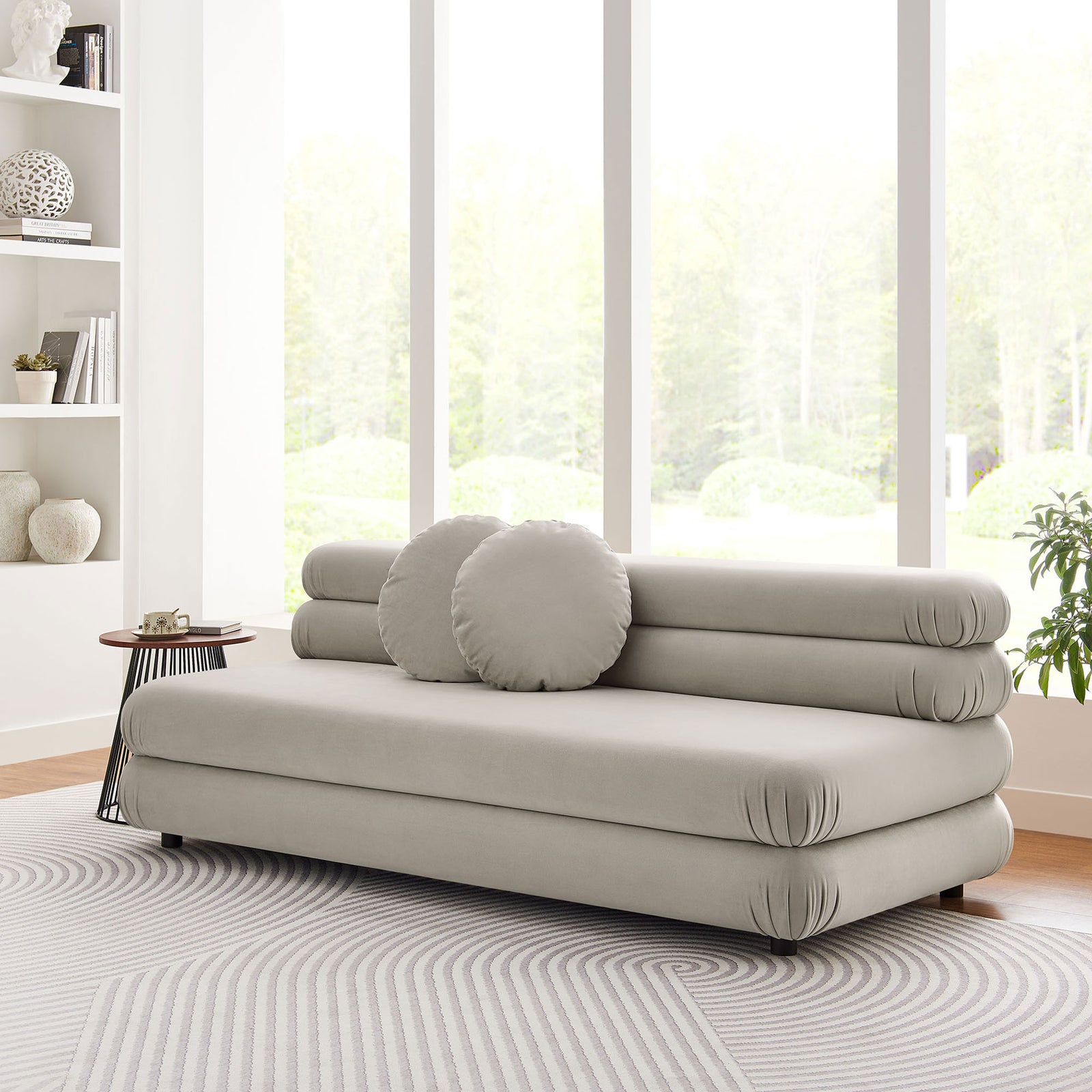 Almond Jubilee velvet loveseat anchored in a modern living room, paired with a side table and round pillows || EEI-6897-ALM || front_angle_room