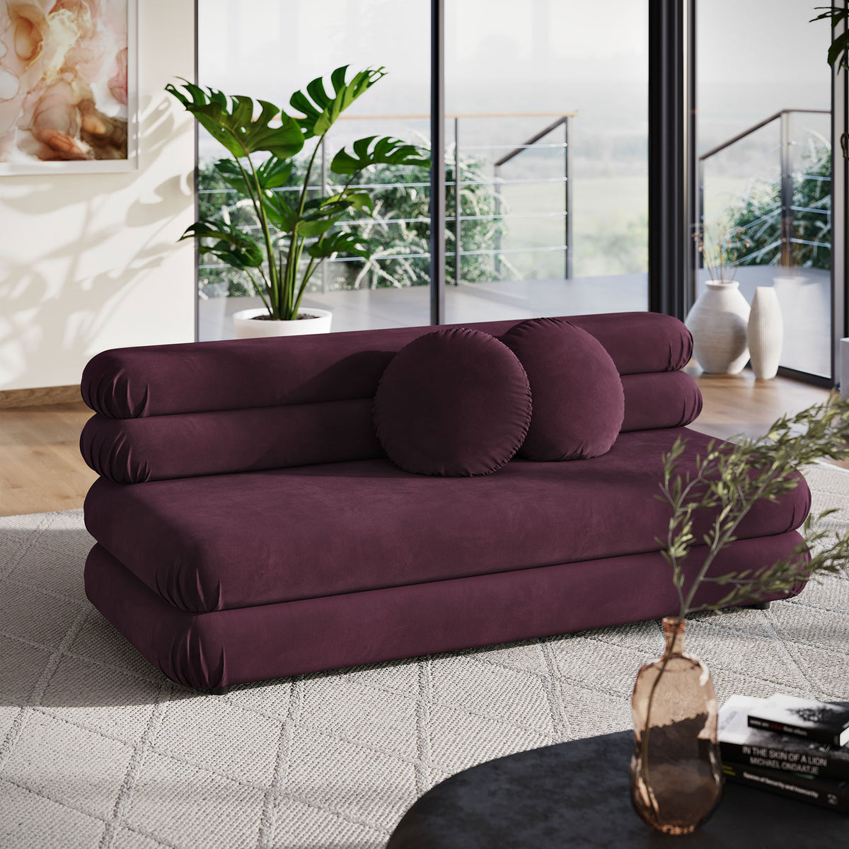 Mulberry velvet loveseat with two round pillows creating a bold focal point in airy loft interior || EEI-6897-MUL || front_room