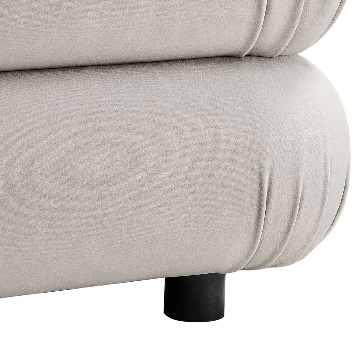 Close-up of the ottoman base showing soft velvet folds and low black support leg || EEI-6899-ALM || leg_studio