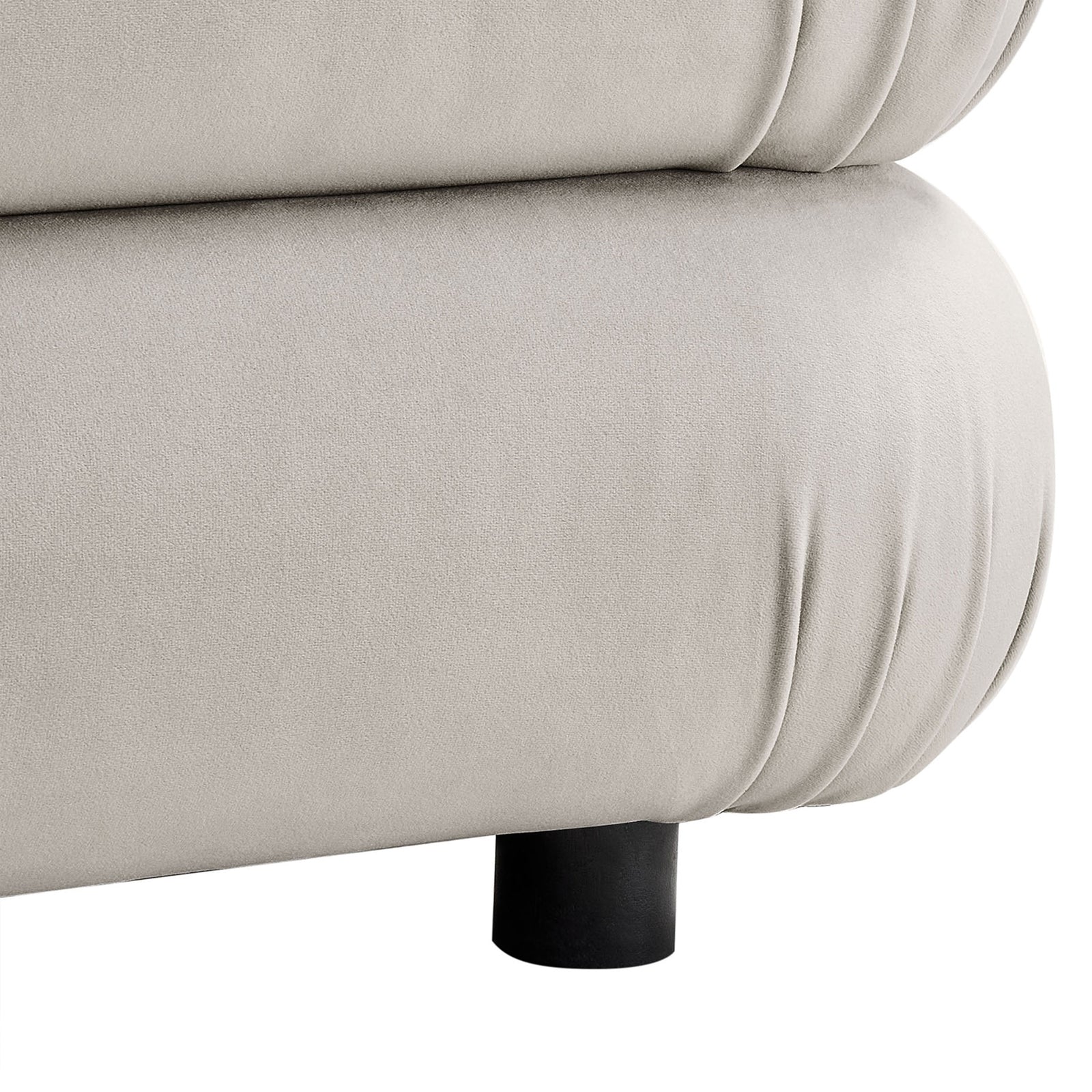 Close-up of the ottoman base showing soft velvet folds and low black support leg || EEI-6899-ALM || leg_studio
